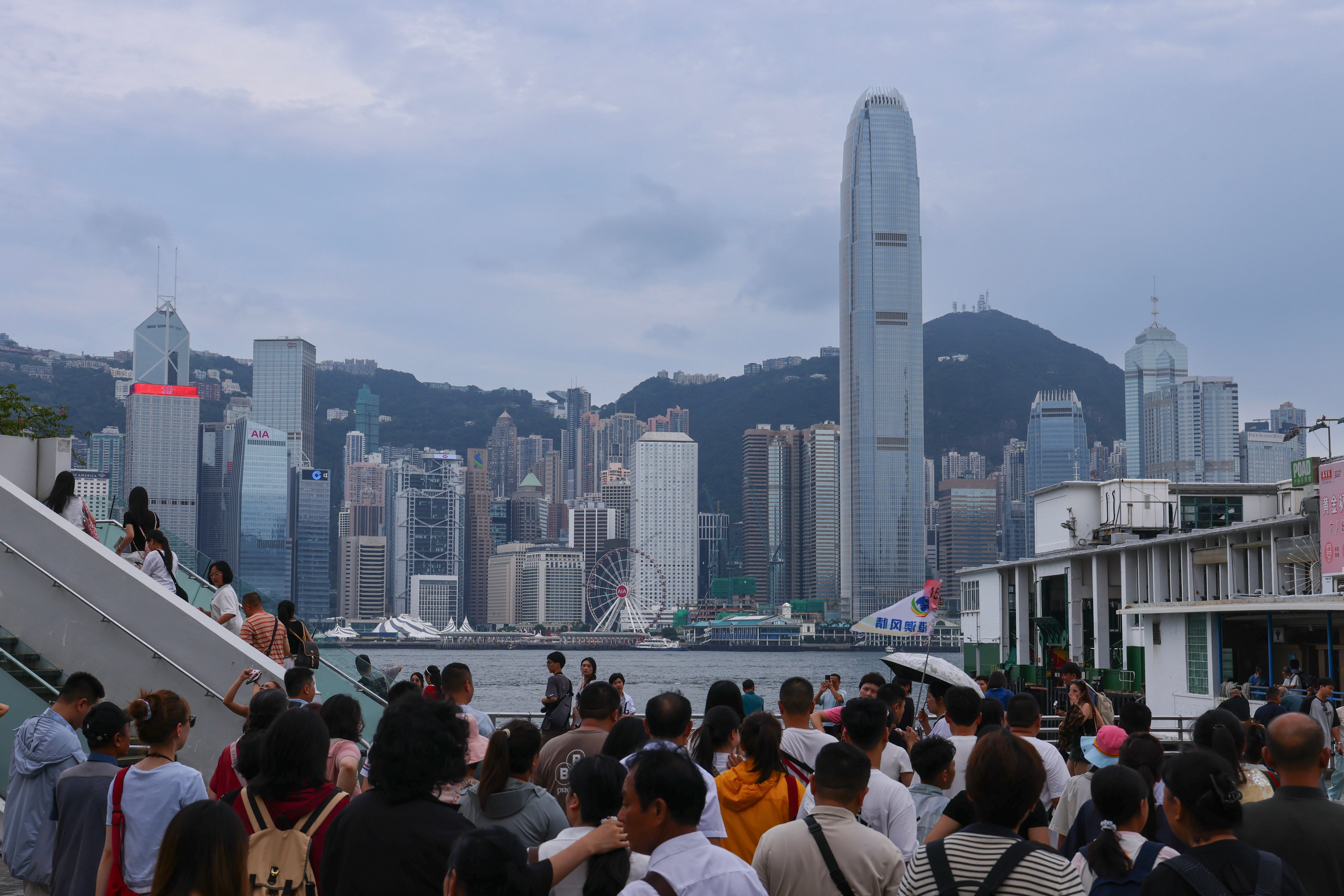 People gather at Victoria Harbour. Hong Kong has logged a 12 per cent increase in tourist arrivals between January and June this year. Photo: Dickson Lee