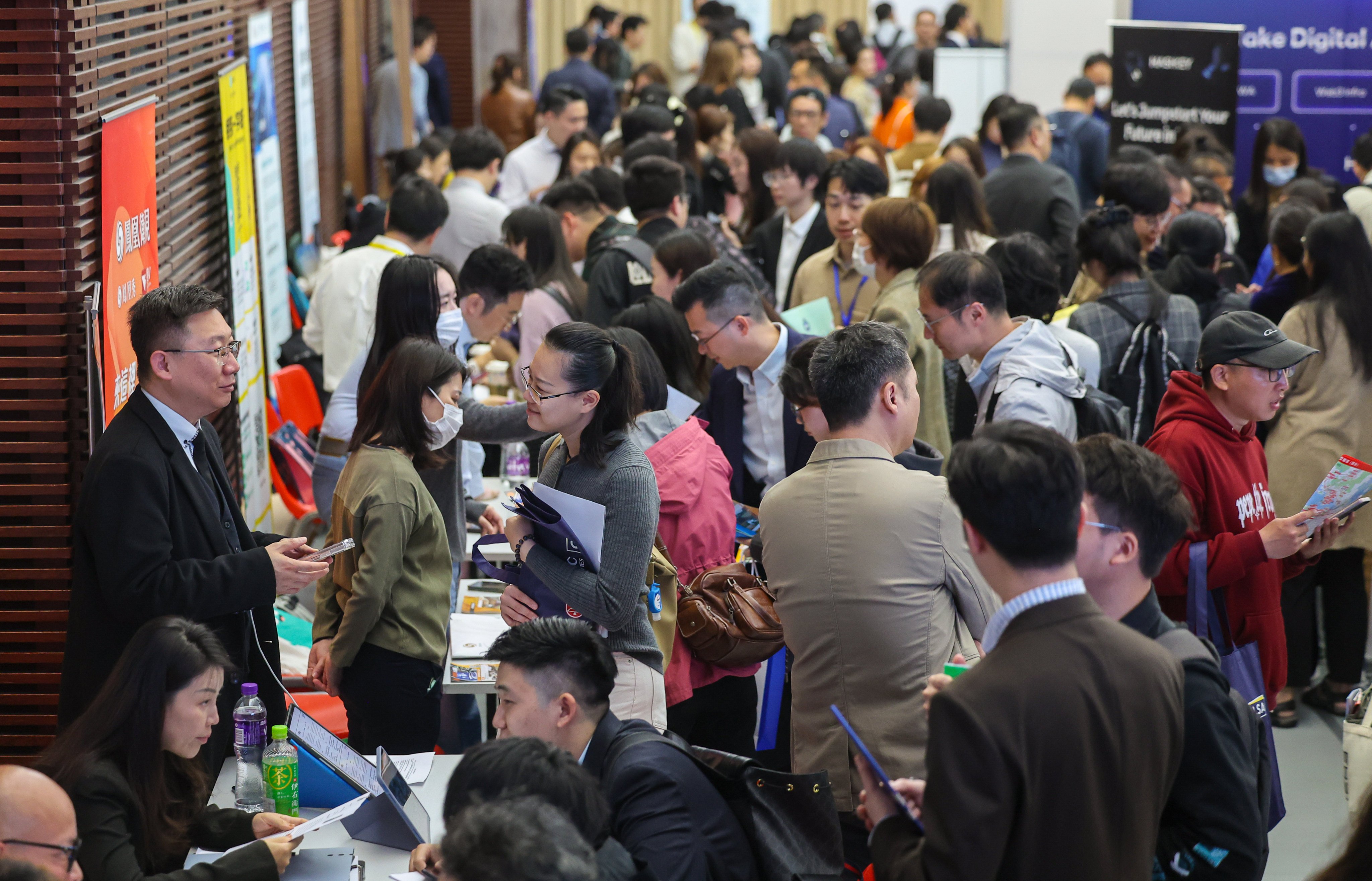 The study’s researchers spoke to the spouses and children of successful admitted under the Quality Migrant Admission Scheme.  Photo: Edmond So