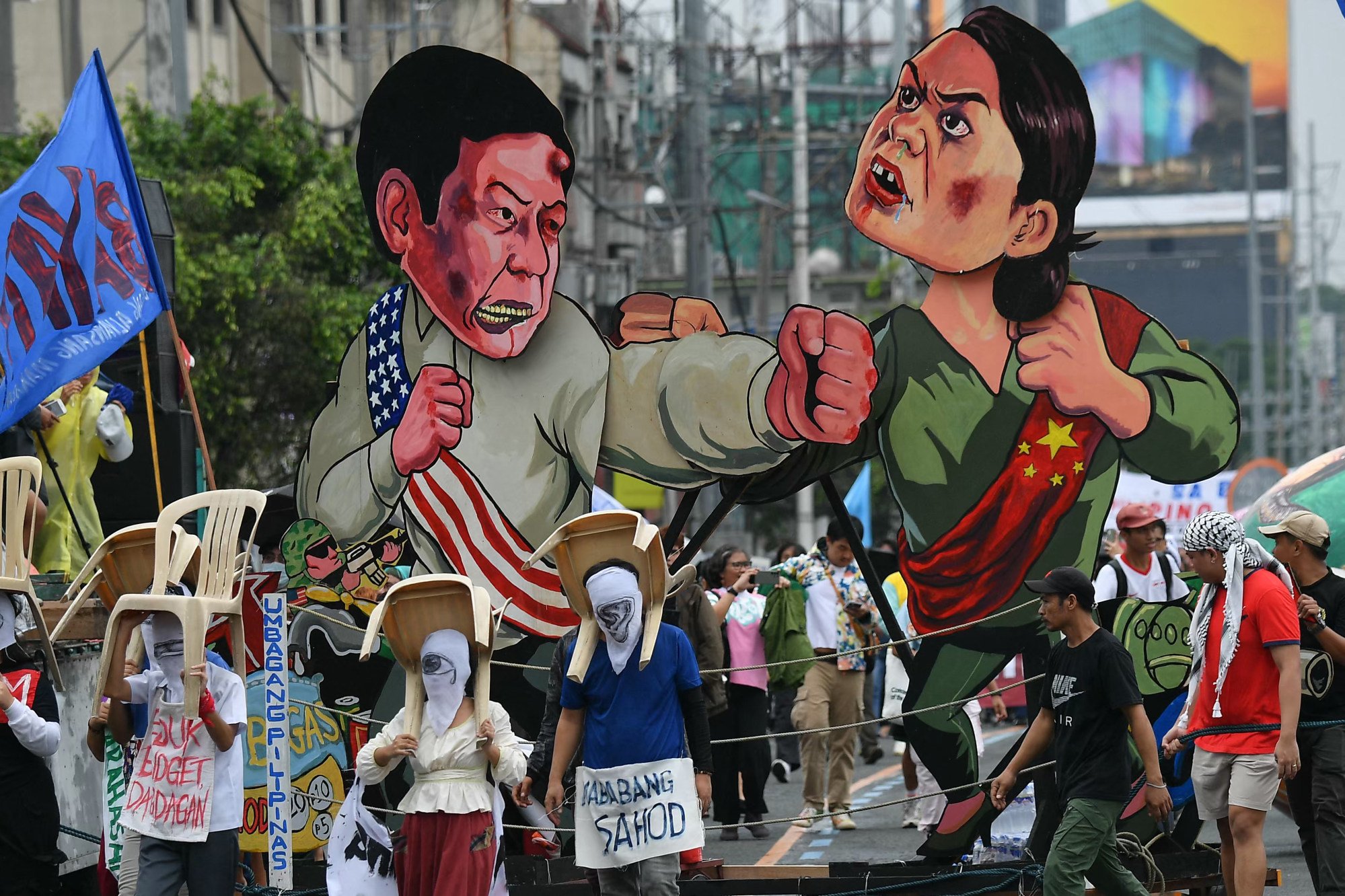 Protesters carry effigies of Philippine President Ferdinand Marcos Jnr (left) and Sara Duterte as they march to Congress last July in a rally coinciding with Marcos’ last state of the nation address. Photo: AFP Protesters carry effigies of Philippine President Ferdinand Marcos Jnr (left) and Sara Duterte as they march to Congress last July in a rally coinciding with Marcos’ last state of the nation address. Photo: AFP
