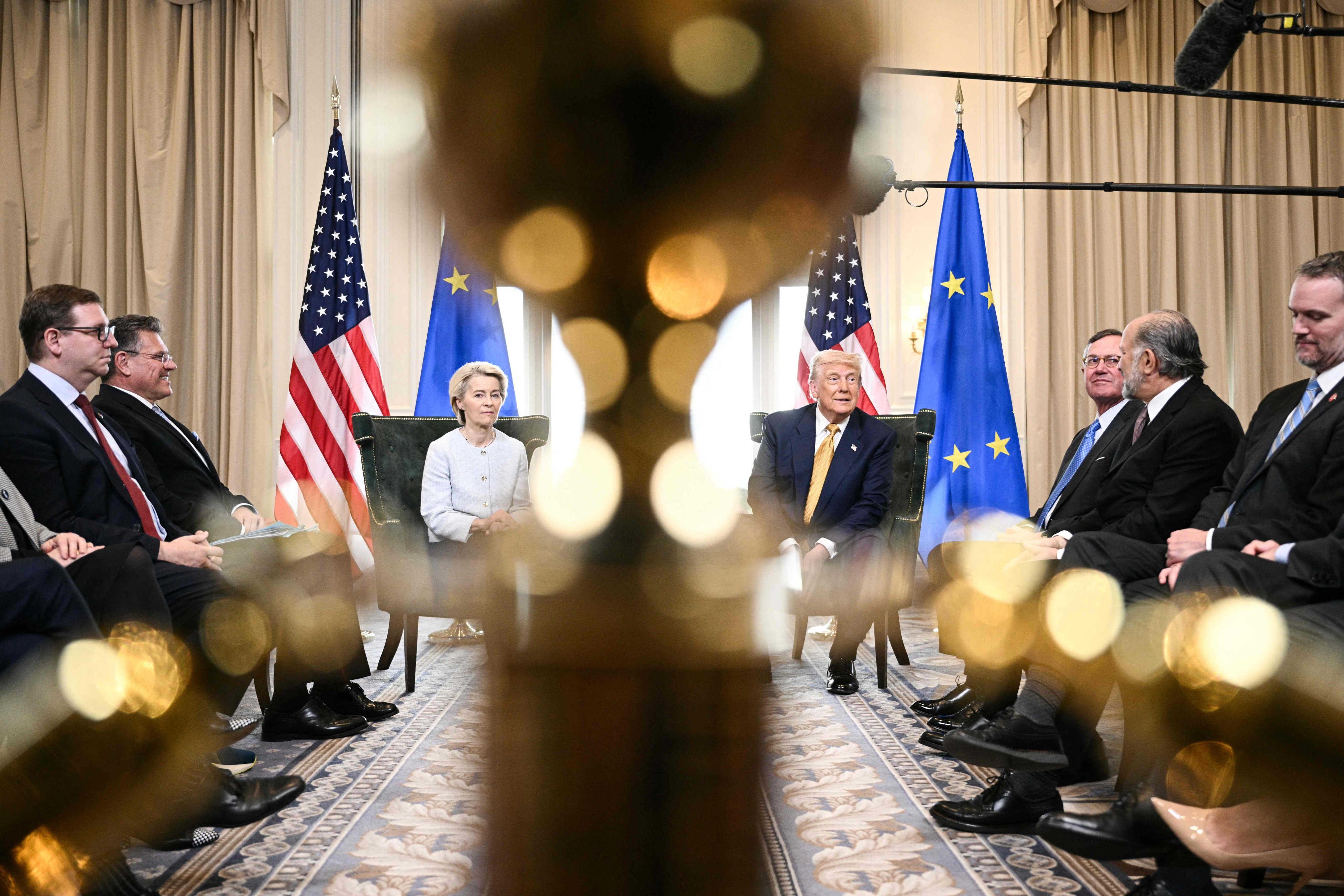European Commission President Ursula von der Leyen sits alongside US President Donald Trump in Scotland on Sunday, when they announced that they had reached a trade deal. Photo: AFP