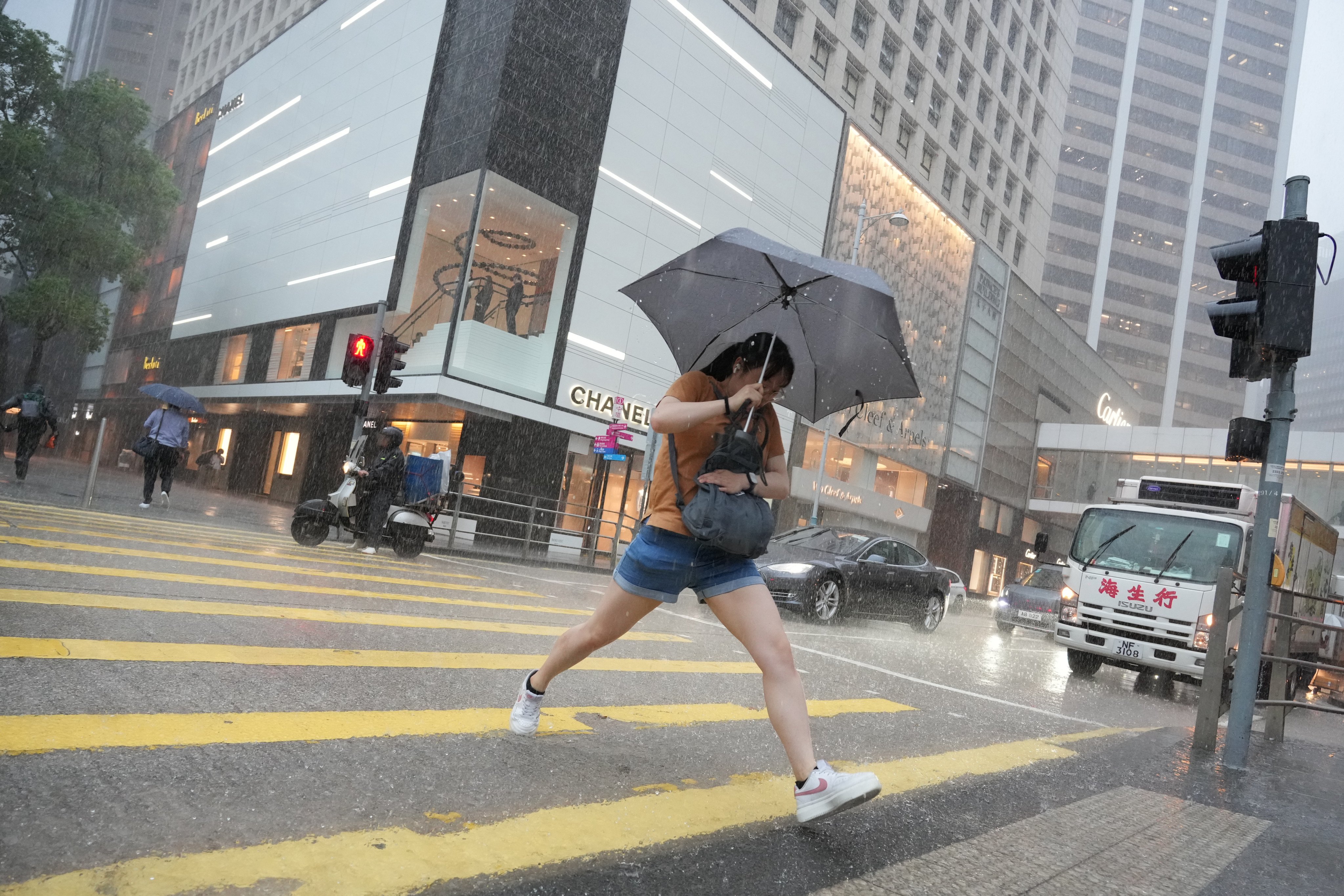 Some areas were hit with more than 100mm of rainfall in an hour, and many Hongkongers were caught in the deluge on their way to work. Photo: May Tse
