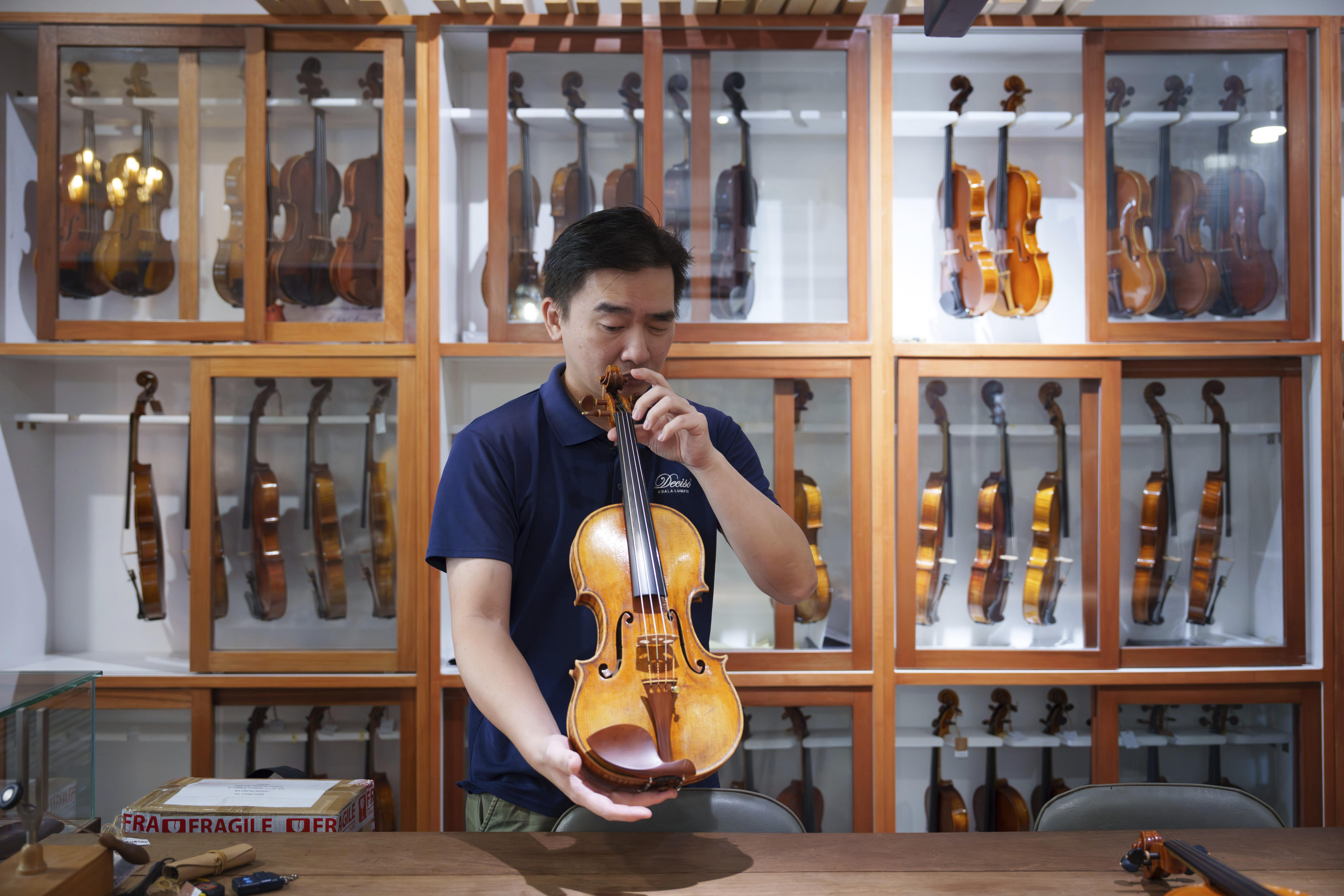 Malaysia’s maestro, Tan Chin Seng, redefines violin-making in Southeast Asia. Photo: AP