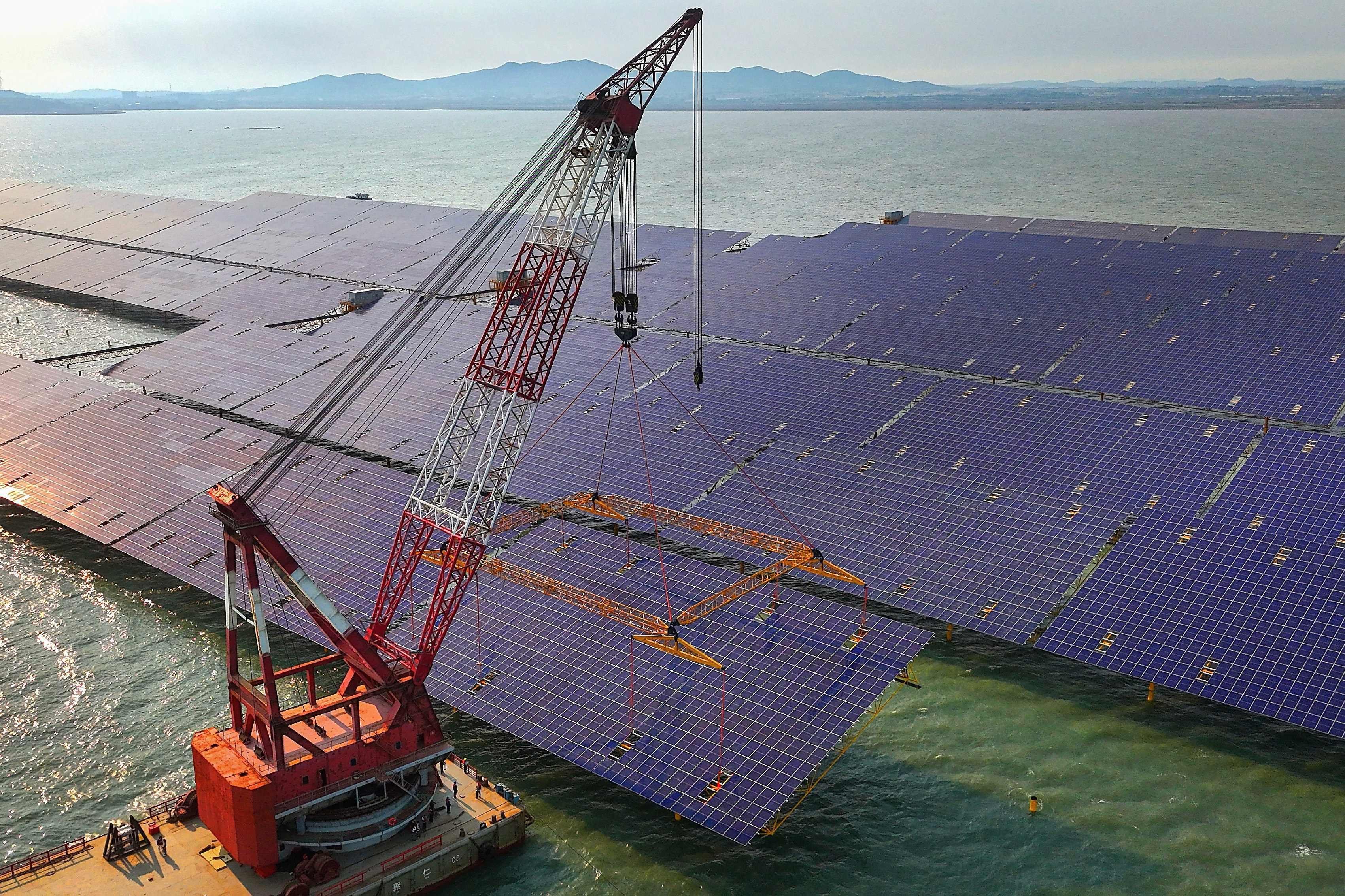 Rows of solar panels are installed as part of a photovoltaic project in eastern China’s Shandong province on May 30. Photo: AFP