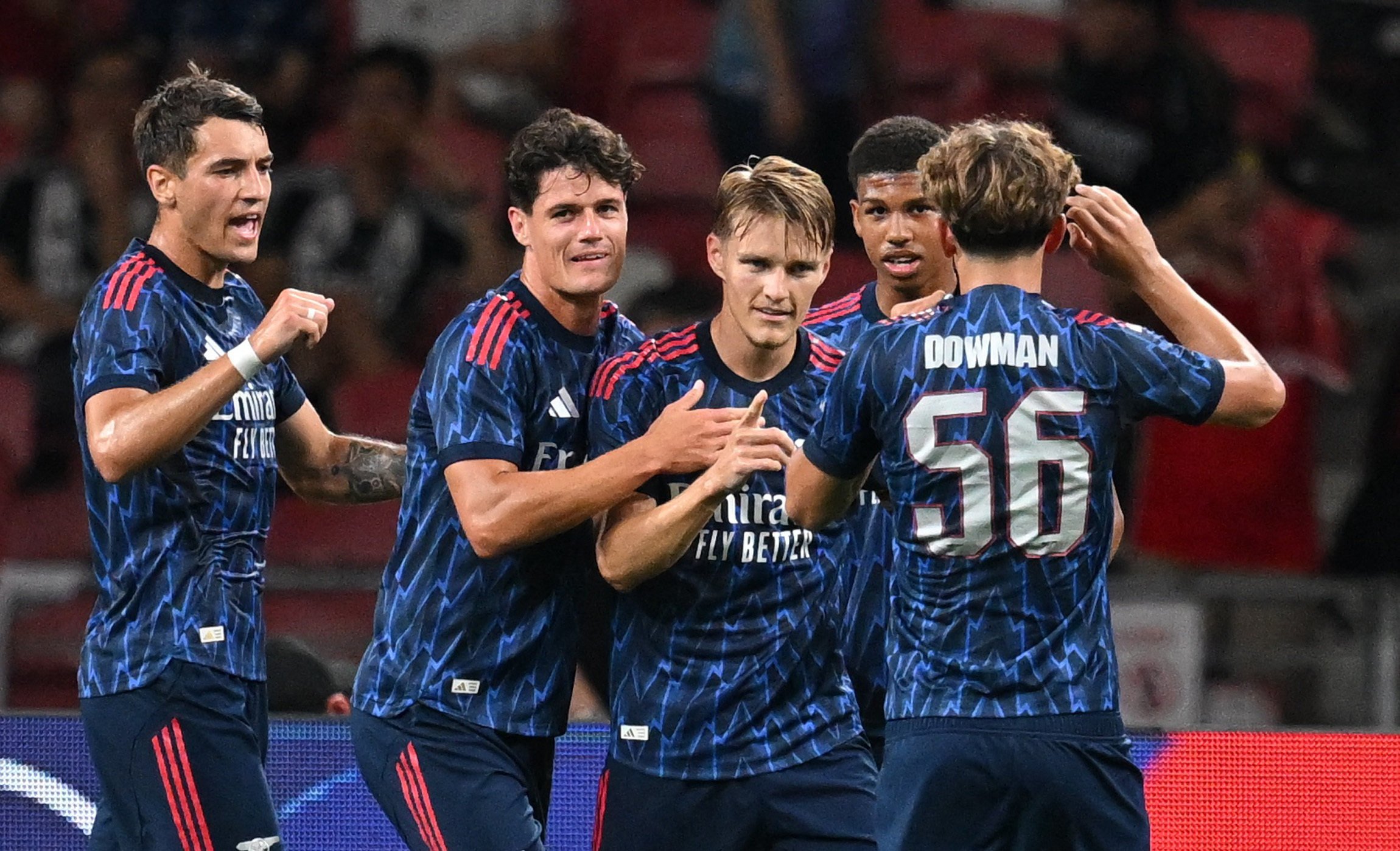 Arsenal players celebrate a goal during their pre-season clash with Newcastle United in Singapore, before their arrival in Hong Kong. Photo: Reuters