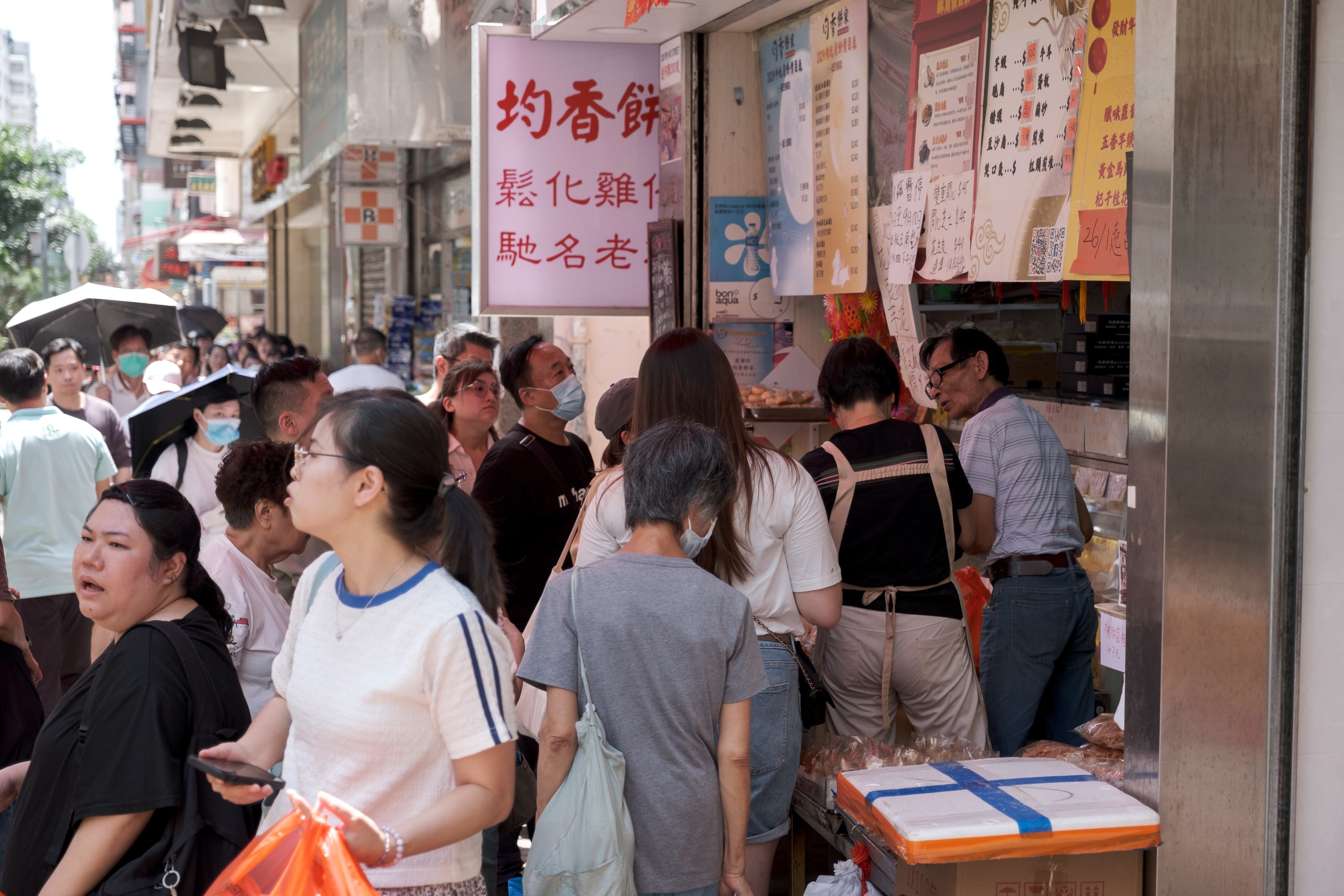 Crowds gather outside a bakery in Sham Shui Po to buy mooncakes and other baked goods on September 11. Photo: Connor Mycroft