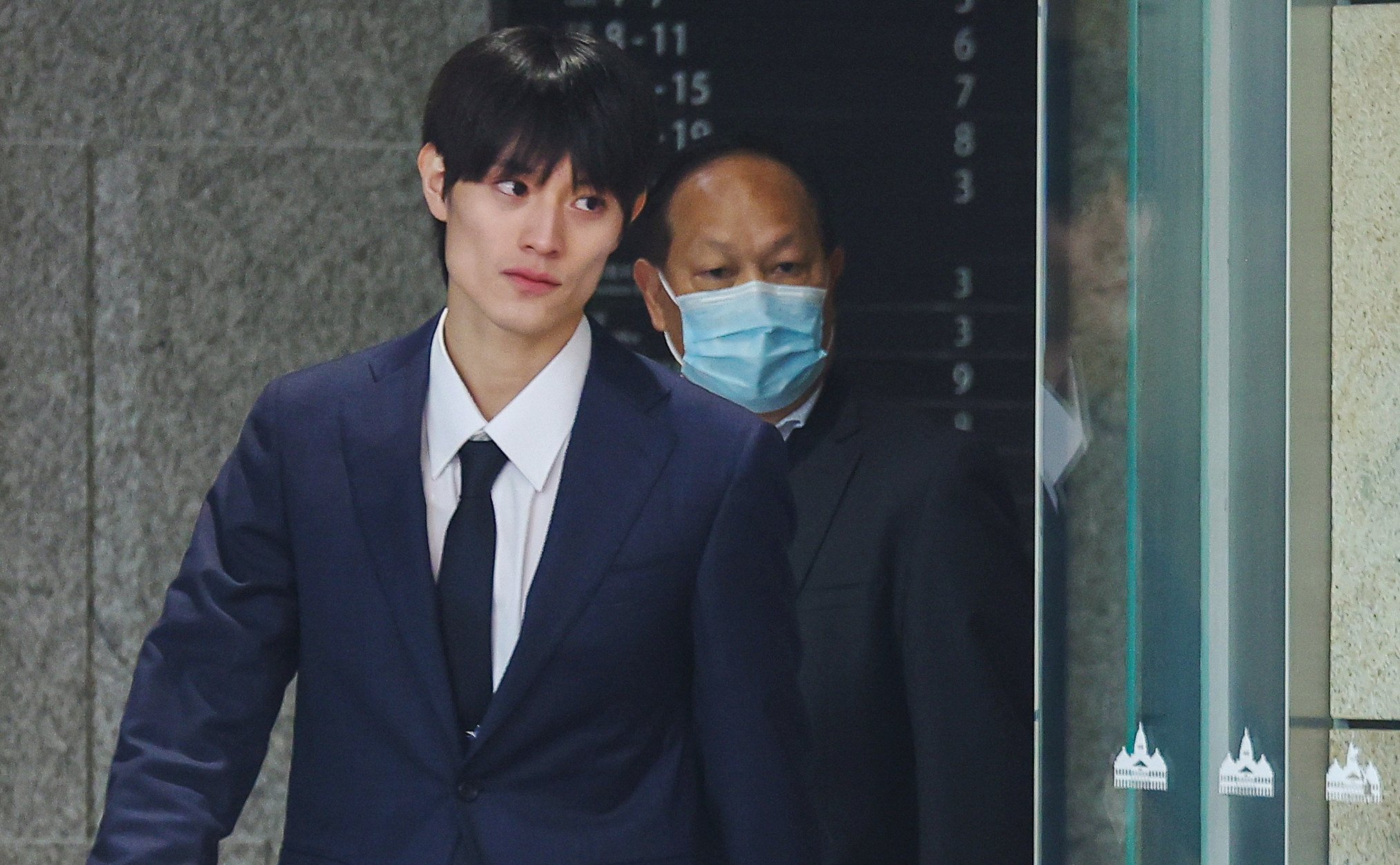Kenshin Kamimura (left) leaves West Kowloon Court on Thursday. Photo: Edmond So
