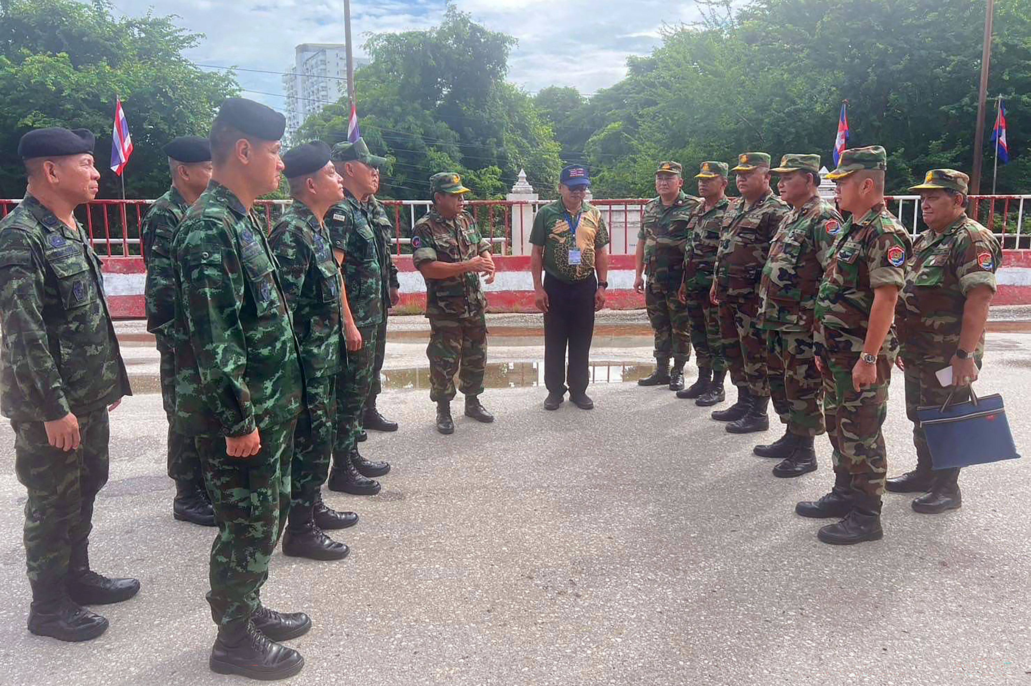 Commanders of the Royal Thai Army (left) and Royal Cambodian Army (right) meet in no man’s land at the Thai-Cambodia border near the Aranyaprathet-Poipet border crossing on Tuesday. Photo: Royal Thai Army/AFP
