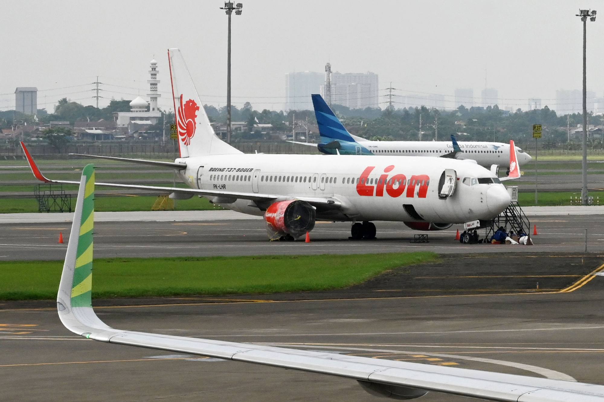 Lion Air and Garuda Indonesia planes at the Sukarno-Hatta International Airport in Tangerang, on the outskirts of Jakarta. Garuda’s market share is much lower than rival Lion Air Group. Photo: AFP