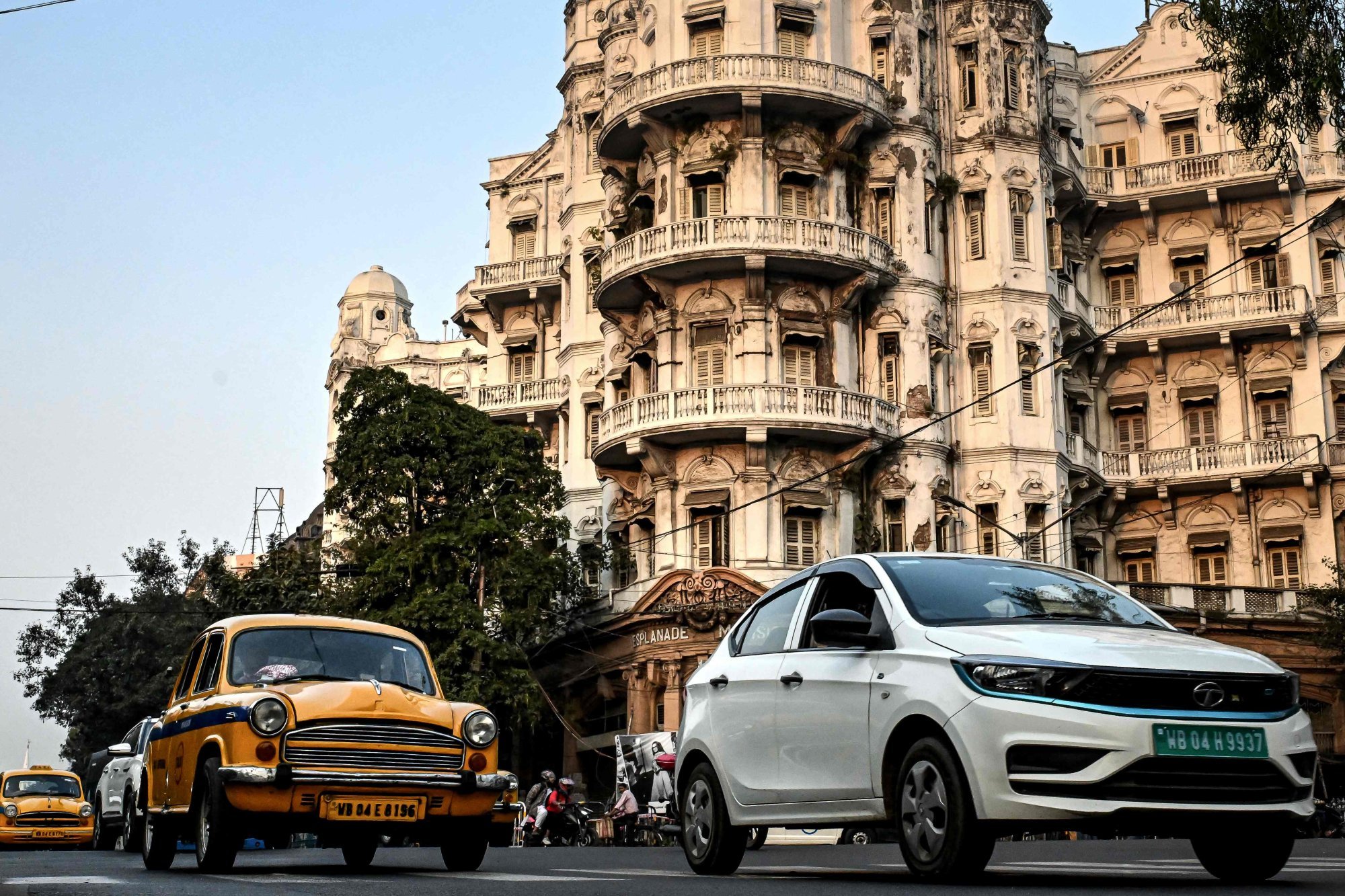 A Tata Motors EV (right) drives past heritage cars and buildings in Kolkata, India, in January. Photo: AFP A Tata Motors EV (right) drives past heritage cars and buildings in Kolkata, India, in January. Photo: AFP