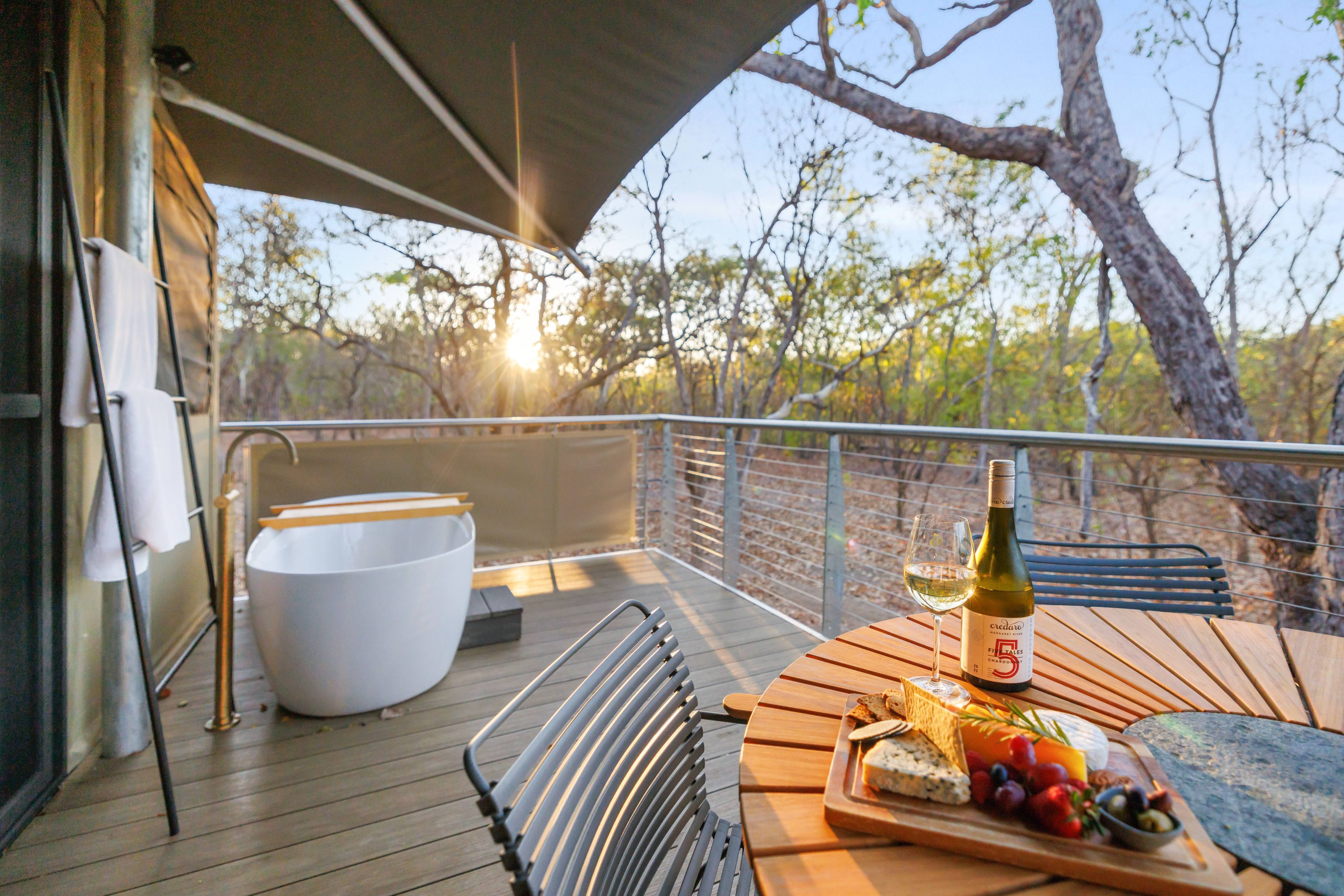 Glamping at Cooinda Lodge, in Australia’s Northern Territory, includes an outdoor bathtub in which to wallow and enjoy the sunset. Photo: Handout