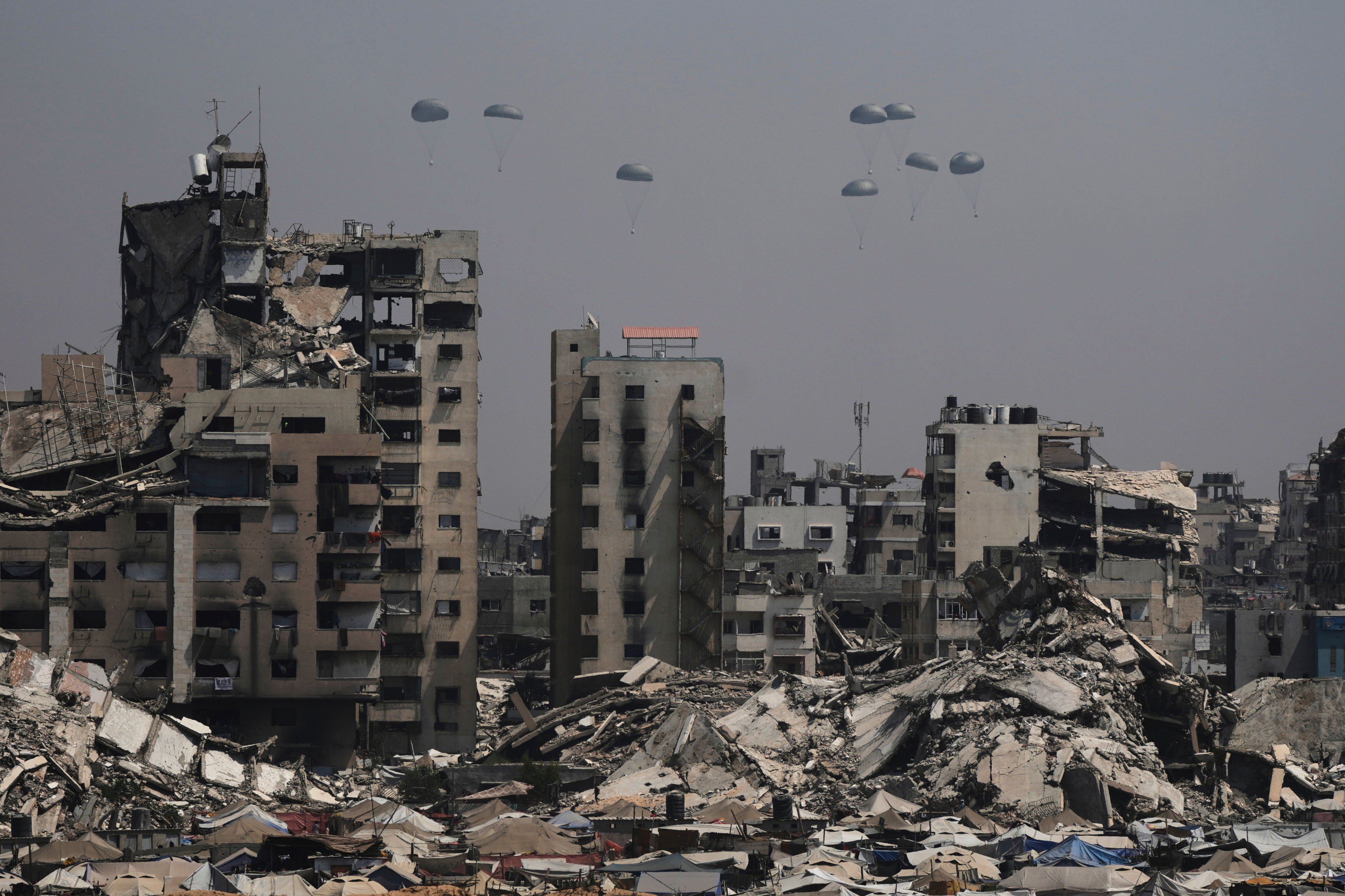 Humanitarian aid is airdropped to Palestinians over Gaza City on Monday. Photo: AP