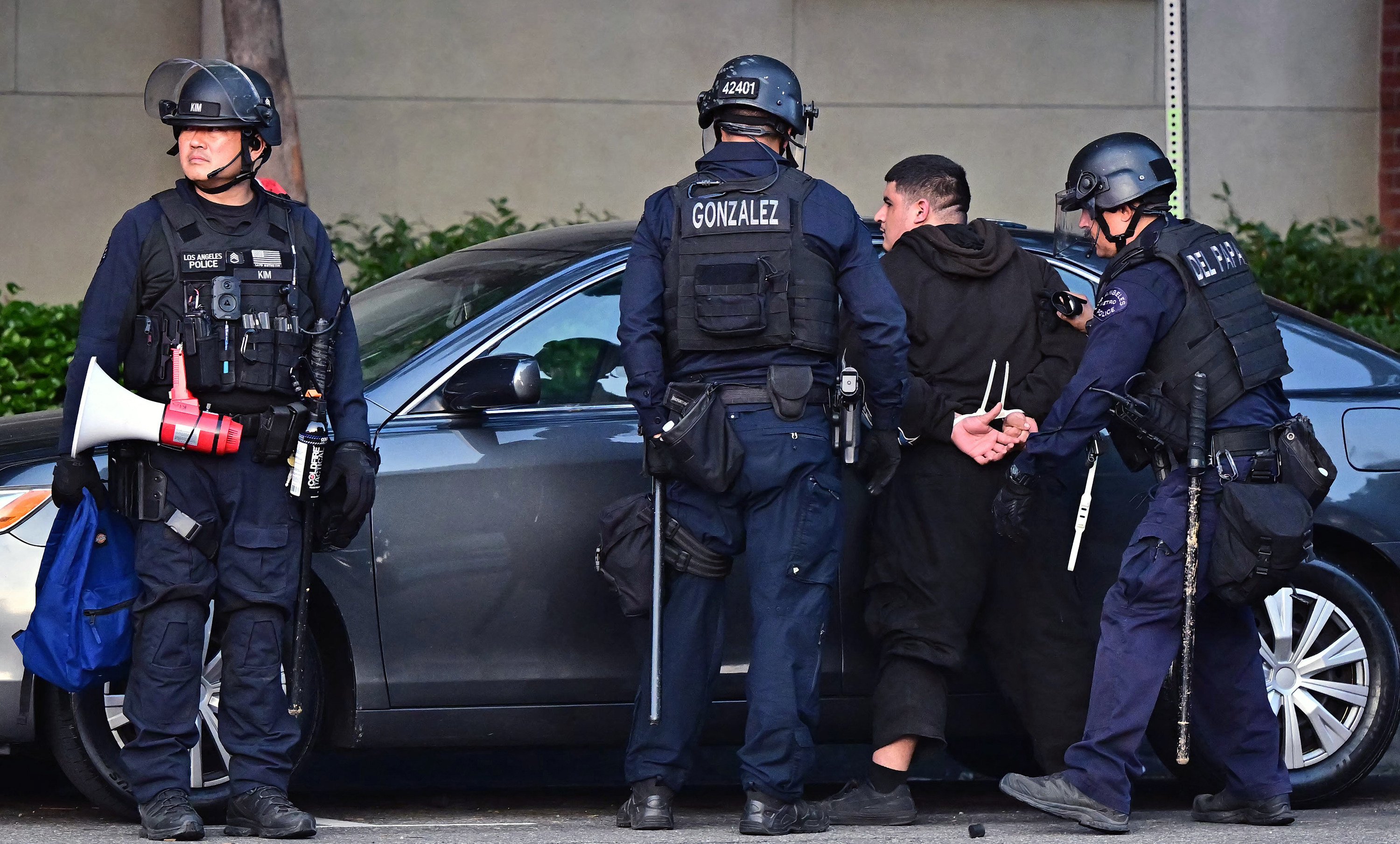 Police make an arrest during a protest in response to federal immigration operations in Los Angeles in June. Photo: via AFP