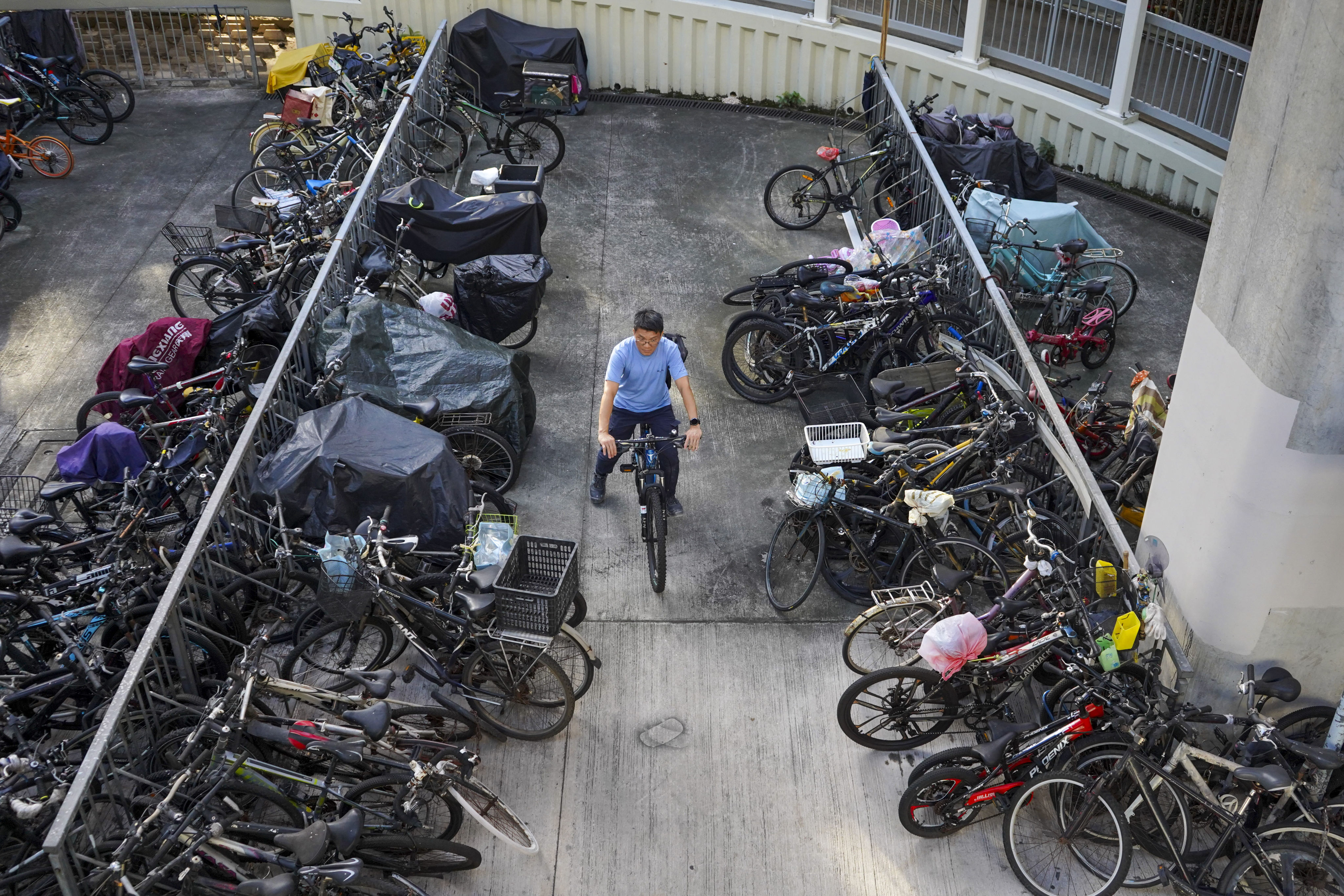 A cyclist looks to exit an area packed with bikes in Sha Tin. Photo: Timon Johnson