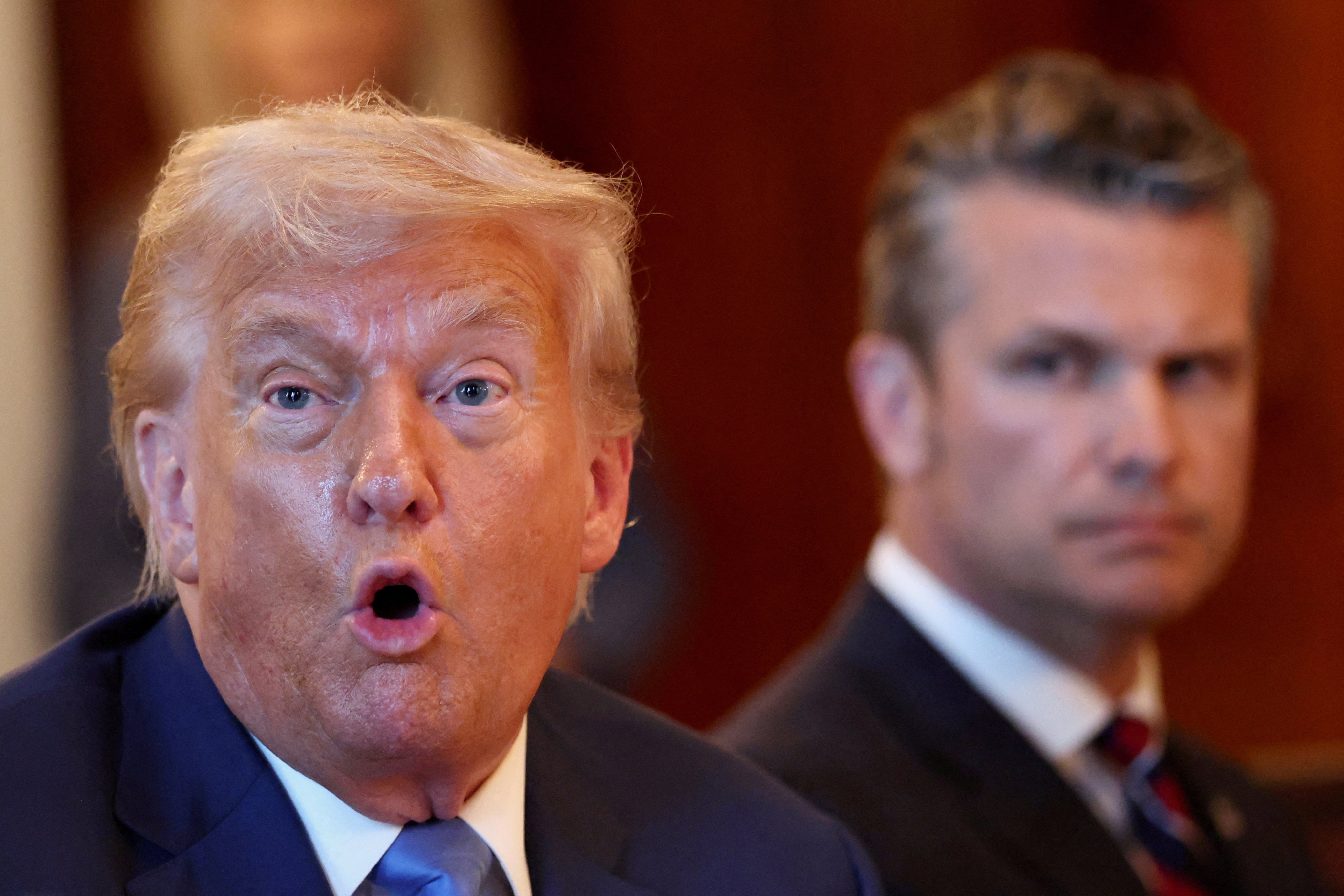 US President Donald Trump (left) speaks during a bilateral dinner with Israeli Prime Minister Benjamin Netanyahu on July 7 while US Defence Secretary Pete Hegseth (right) looks on. Photo: Reuters