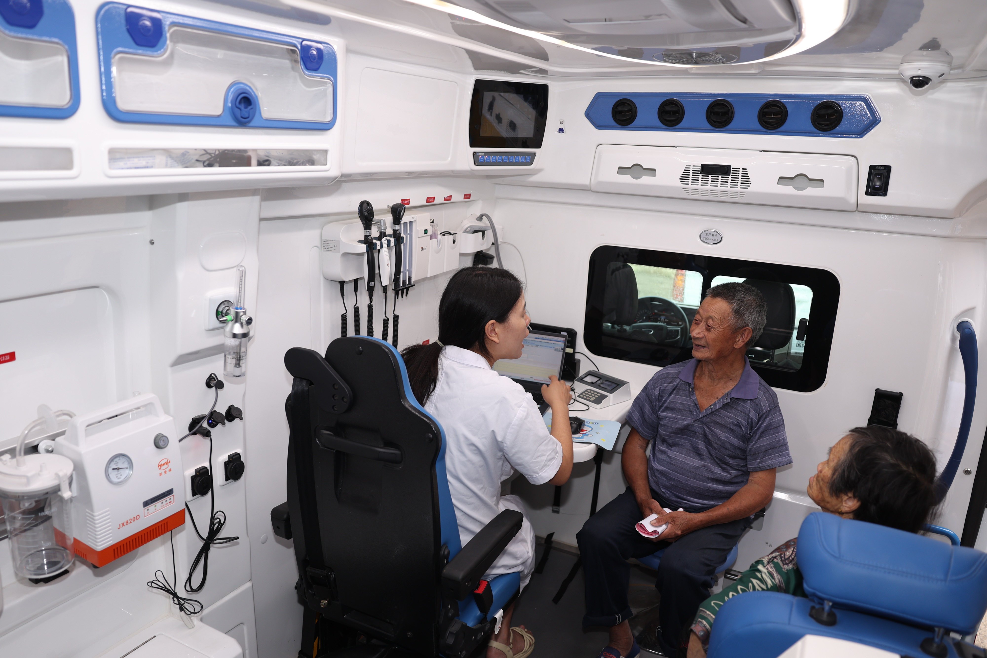 A doctor examines a patient on a medical vehicle in Libao Village, Zhejiang province on July 8.  Consumption grows most sustainably not through subsidies or slogans, but through better jobs, stronger safety nets and more accessible services. Photo: Xinhua