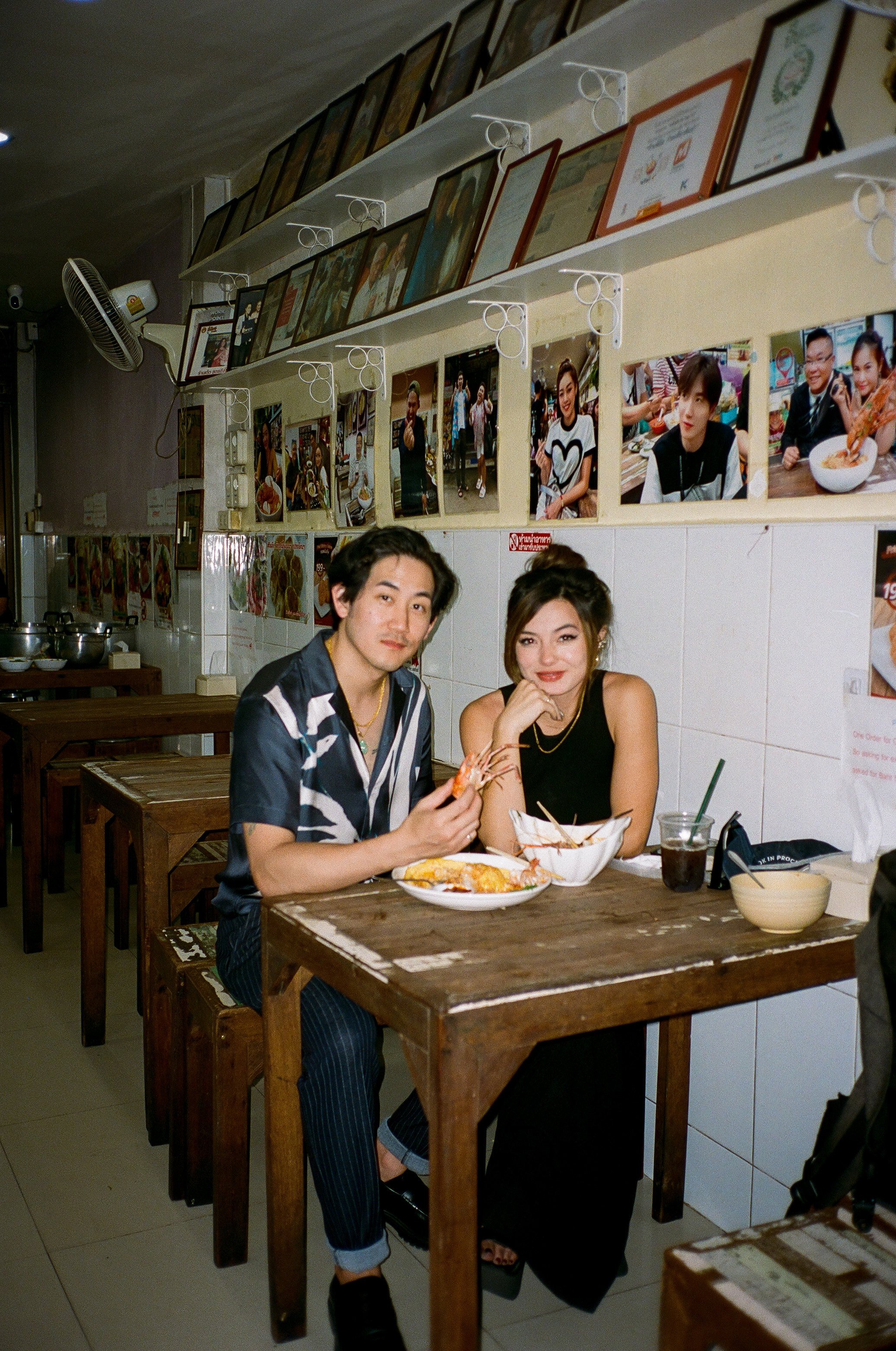 Ewa and Jeromy Ko eat a meal at Pe Aor Tom Yum Kung Noodle in Bangkok, Thailand. The founders of Nom Life have turned their passion for Asian cuisine and family into a thriving food and travel platform.