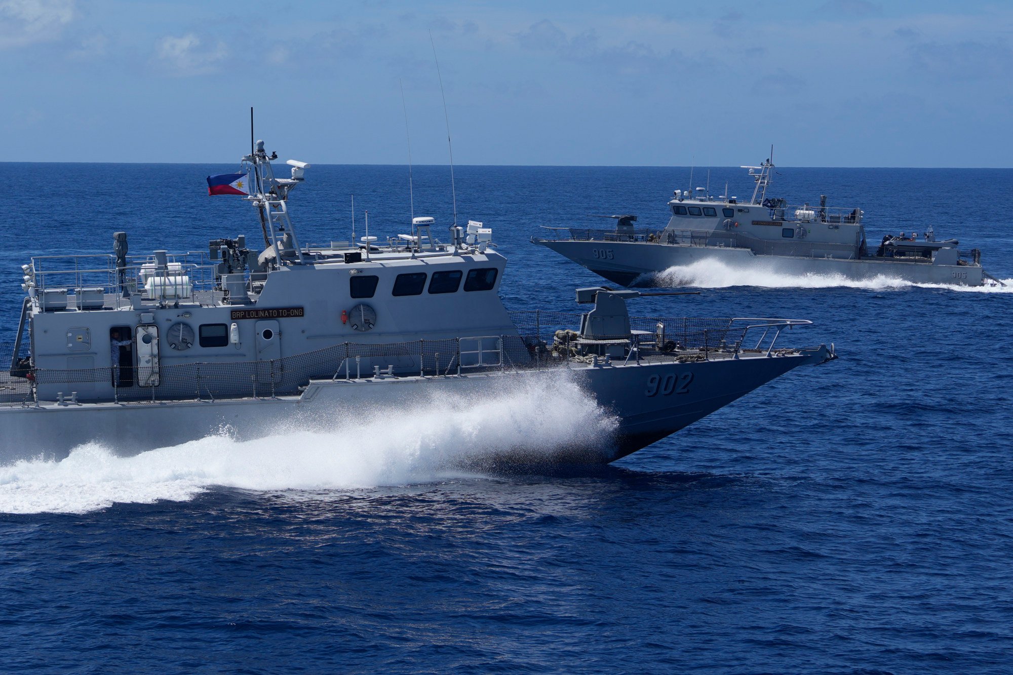 Philippine fast-attack craft practise interception manoeuvres during a joint military drill in the South China Sea last year. Photo: AP Philippine fast-attack craft practise interception manoeuvres during a joint military drill in the South China Sea last year. Photo: AP