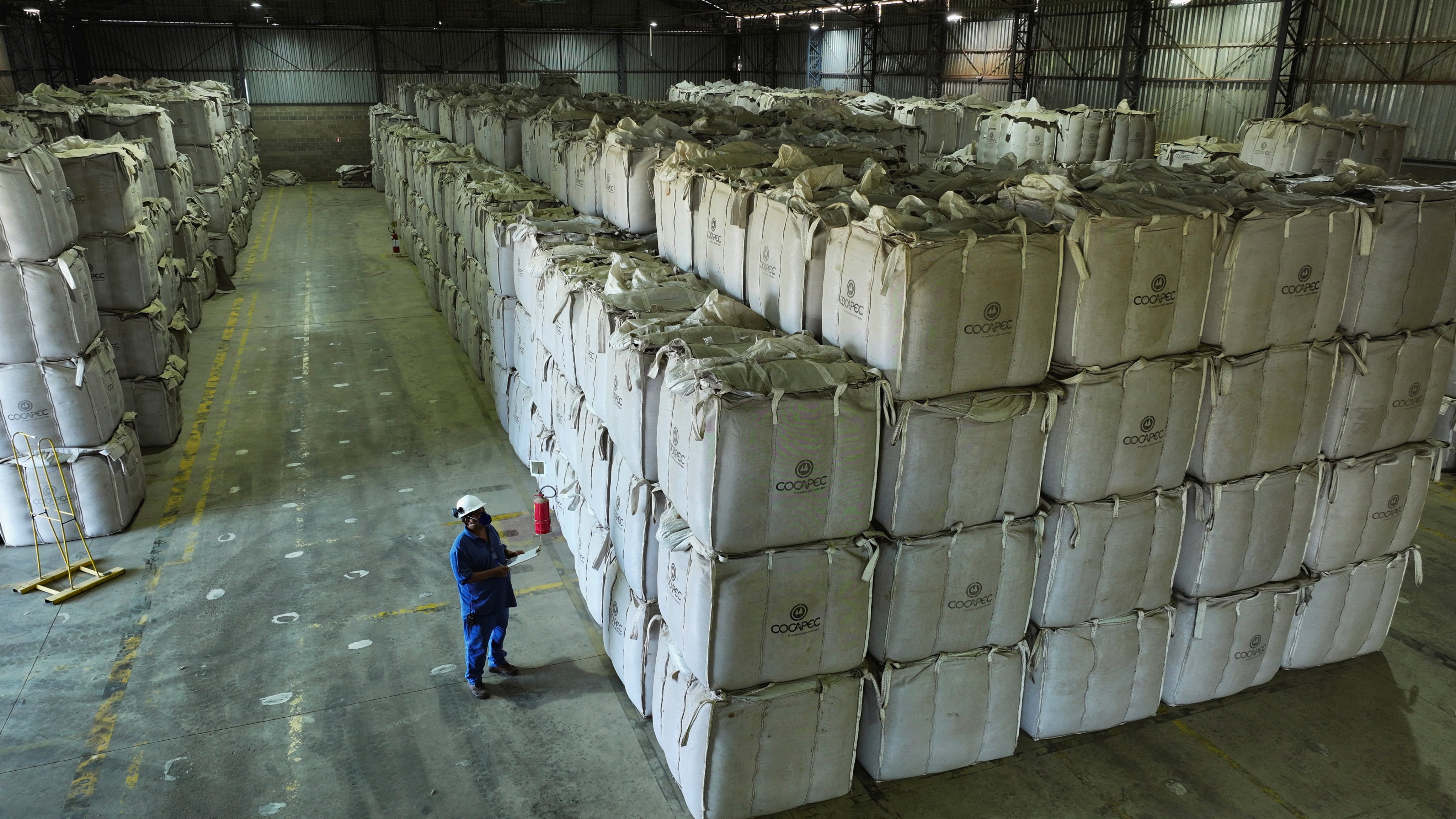 A worker checks super sacks with coffee beans at a farmers’ cooperative warehouse in Franca, Brazil, Friday. Photo: Reuters
