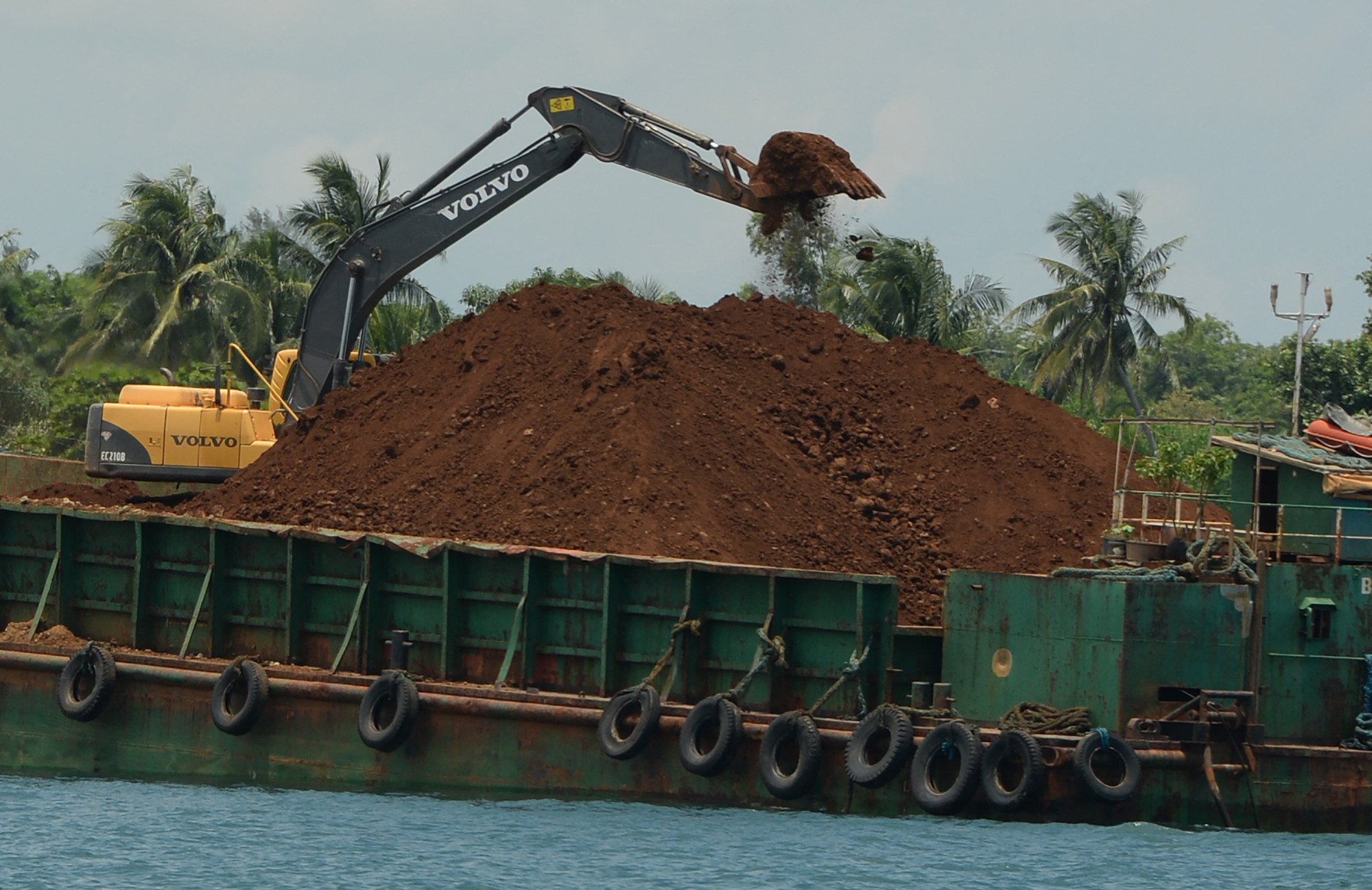 A barge being loaded with nickel ore in Pangasinan province, north of Manila. The Philippines is the second-largest producer of nickel behind Indonesia. Photo: AFP A barge being loaded with nickel ore in Pangasinan province, north of Manila. The Philippines is the second-largest producer of nickel behind Indonesia. Photo: AFP
