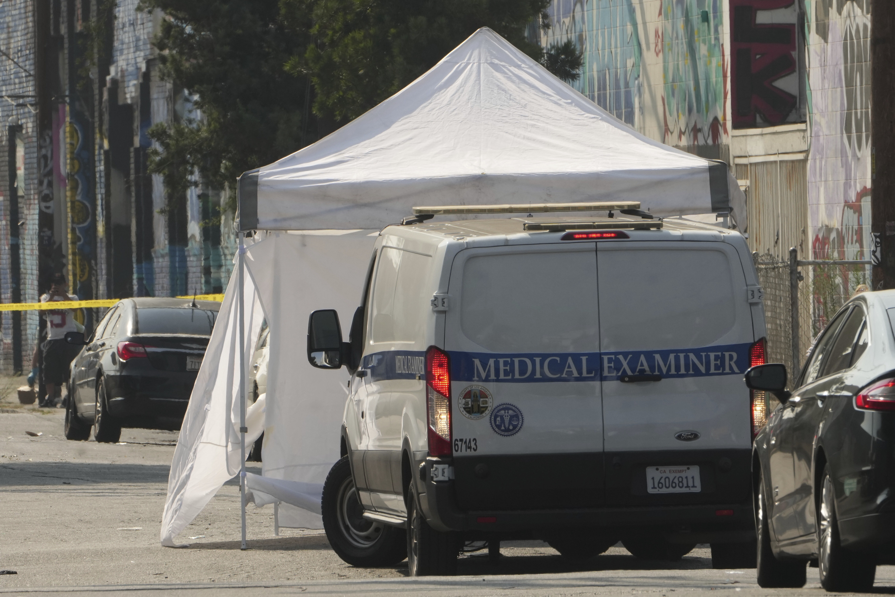 The Los Angeles Coroner Medical Examiner arrives to remove bodies from the scene. Photo: AP