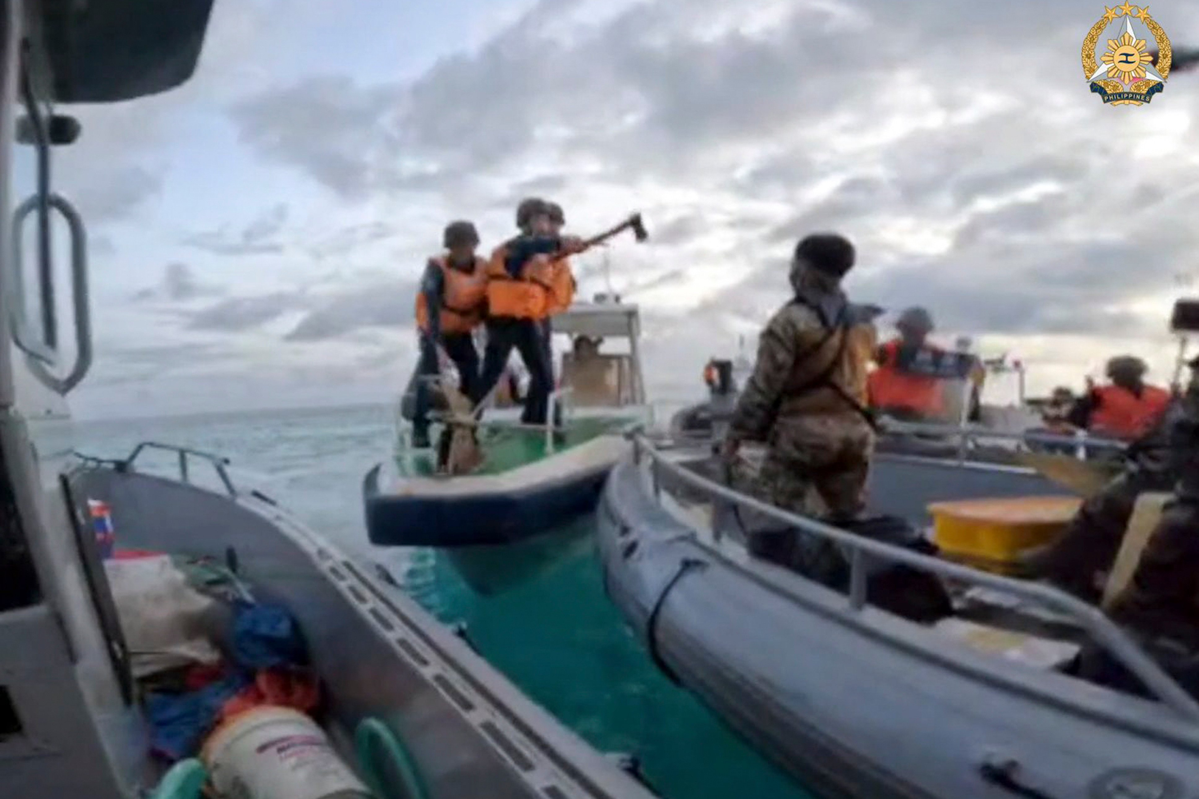 Armed Chinese personnel intercept Philippine troops on a resupply mission to the Second Thomas Shoal on June 17, 2024. Photo: Armed Forces of the Philippines/AP