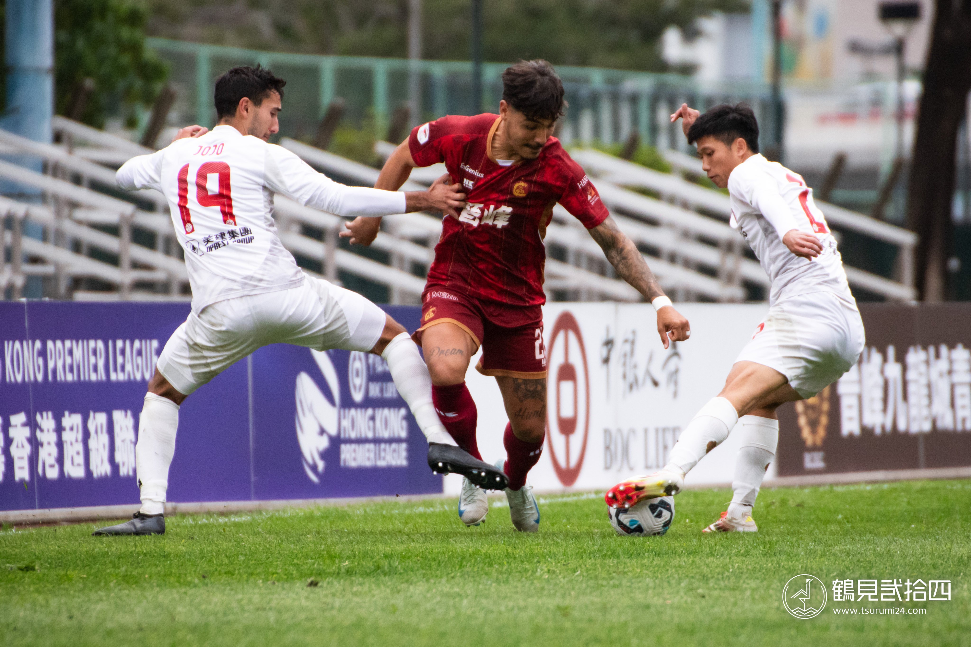 Kowloon City’s Kayron Ramos (middle) tries to evade the Eastern pair of Alex Jojo and Timmy Ma. Photo: Kowloon City FC