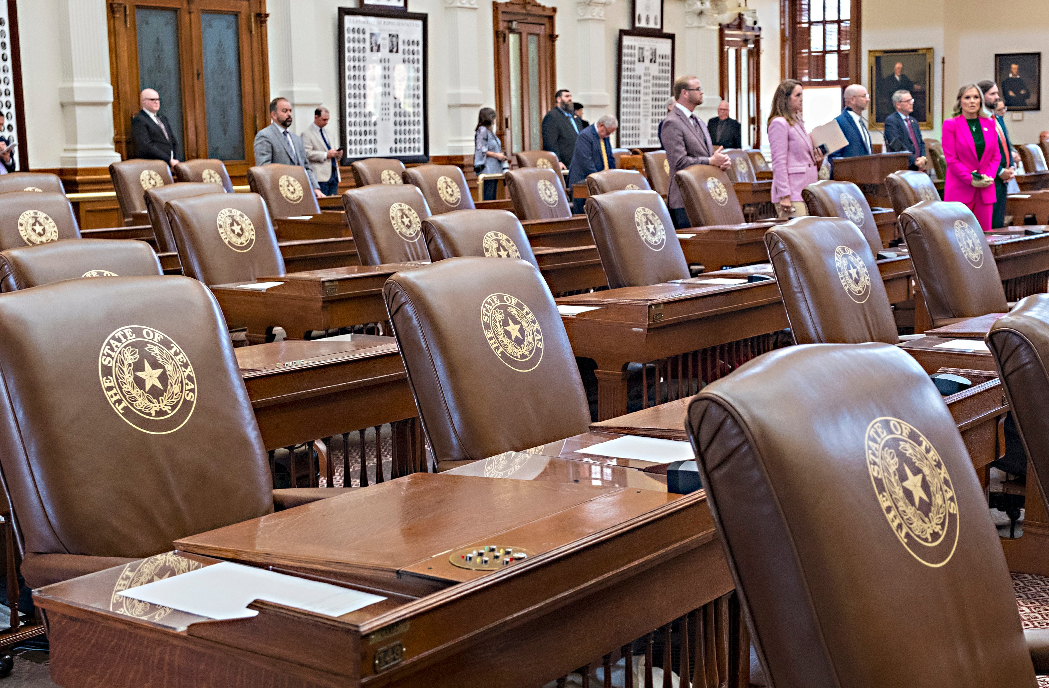 Empty chairs belonging to House Democrats remain empty during a session convocation in the Texas State Capitol in Austin on Tuesday. Photo: AP