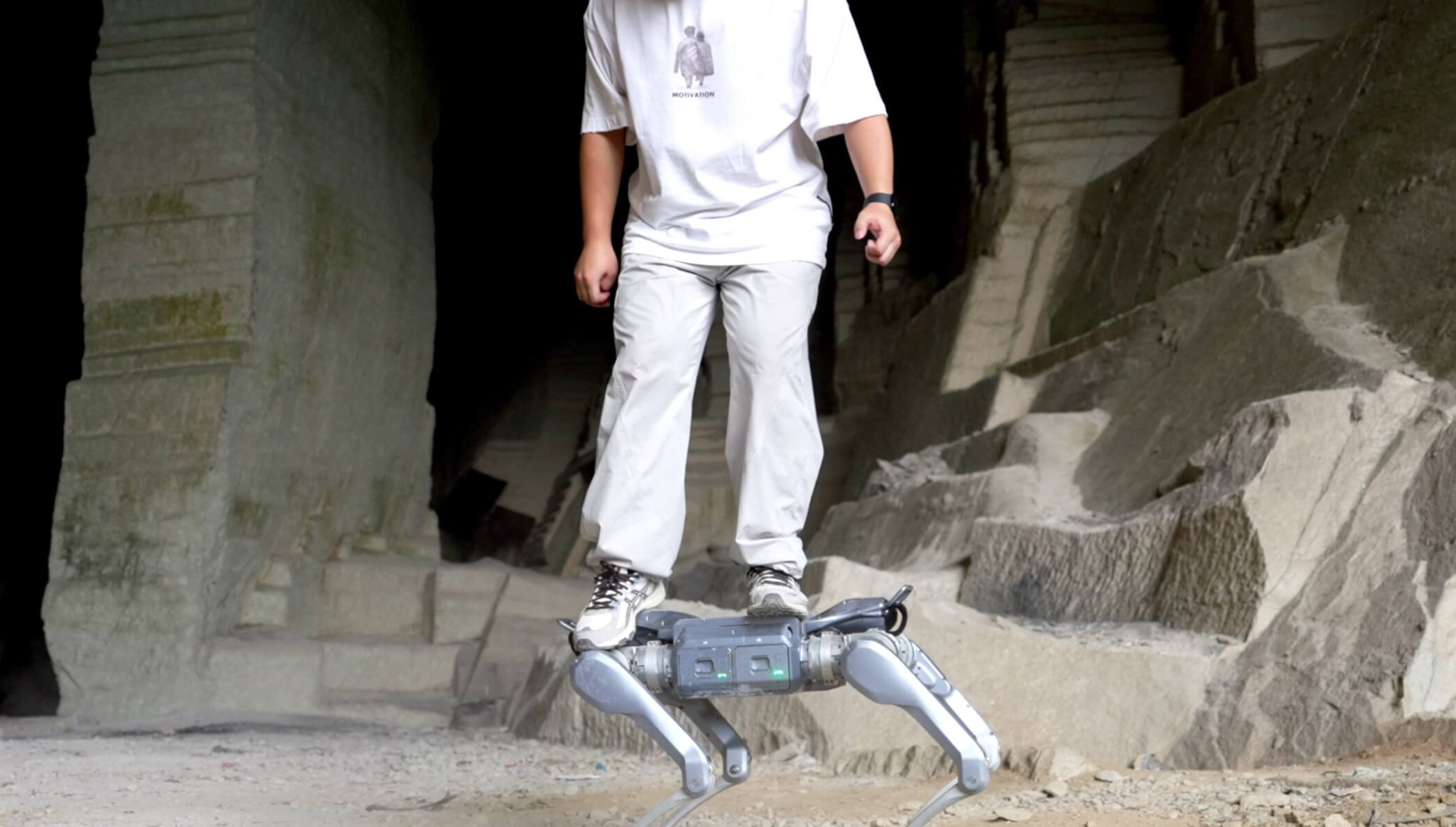 A man stands on Unitree Robotics’ new robot dog, the A2. Photo: Handout