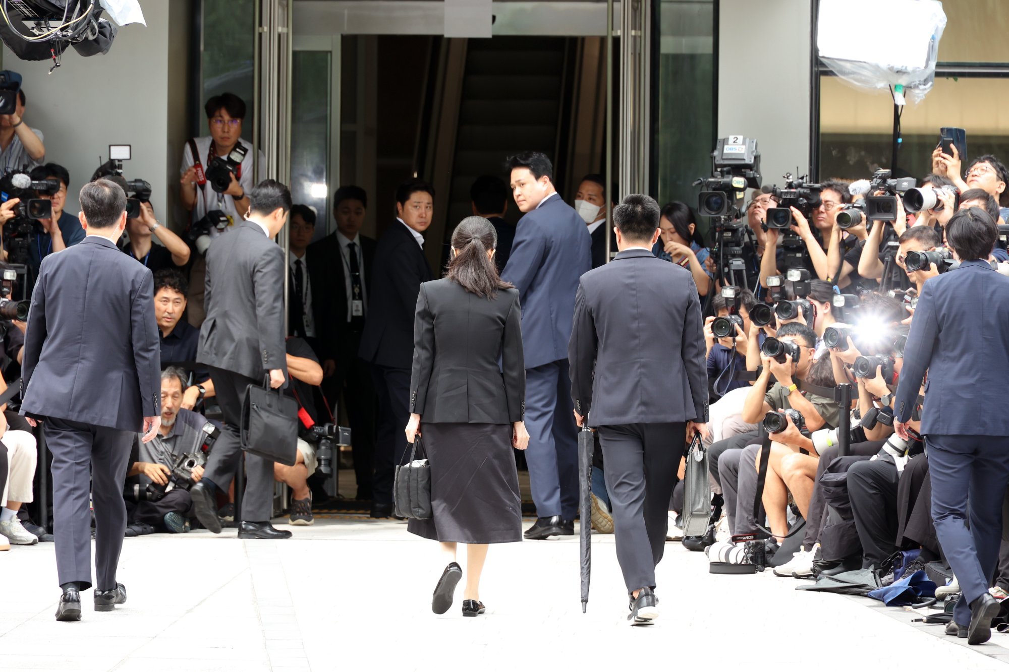Kim Keon-hee (centre) enters the special prosecutor’s office in Seoul on Wednesday. Photo: Yonhap/EPA Kim Keon-hee (centre) enters the special prosecutor’s office in Seoul on Wednesday. Photo: Yonhap/EPA