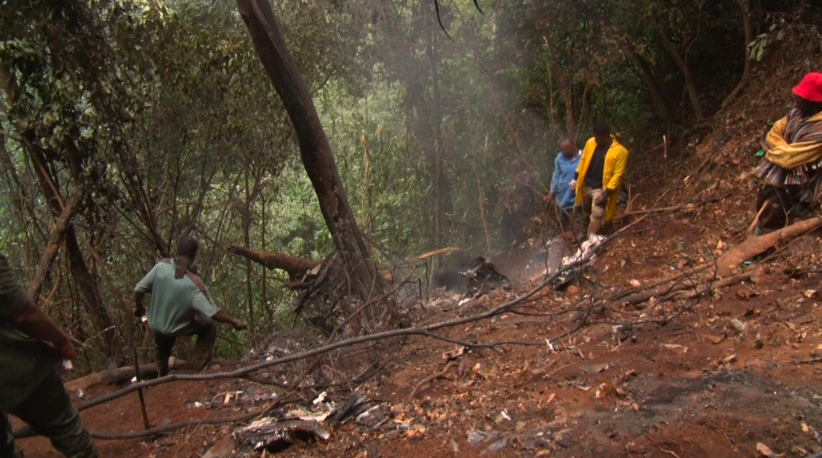 People work at the site of a military helicopter crash in Sikaman near Adansi, in Ghana’s Ashanti region on Wednesday. Photo: AP