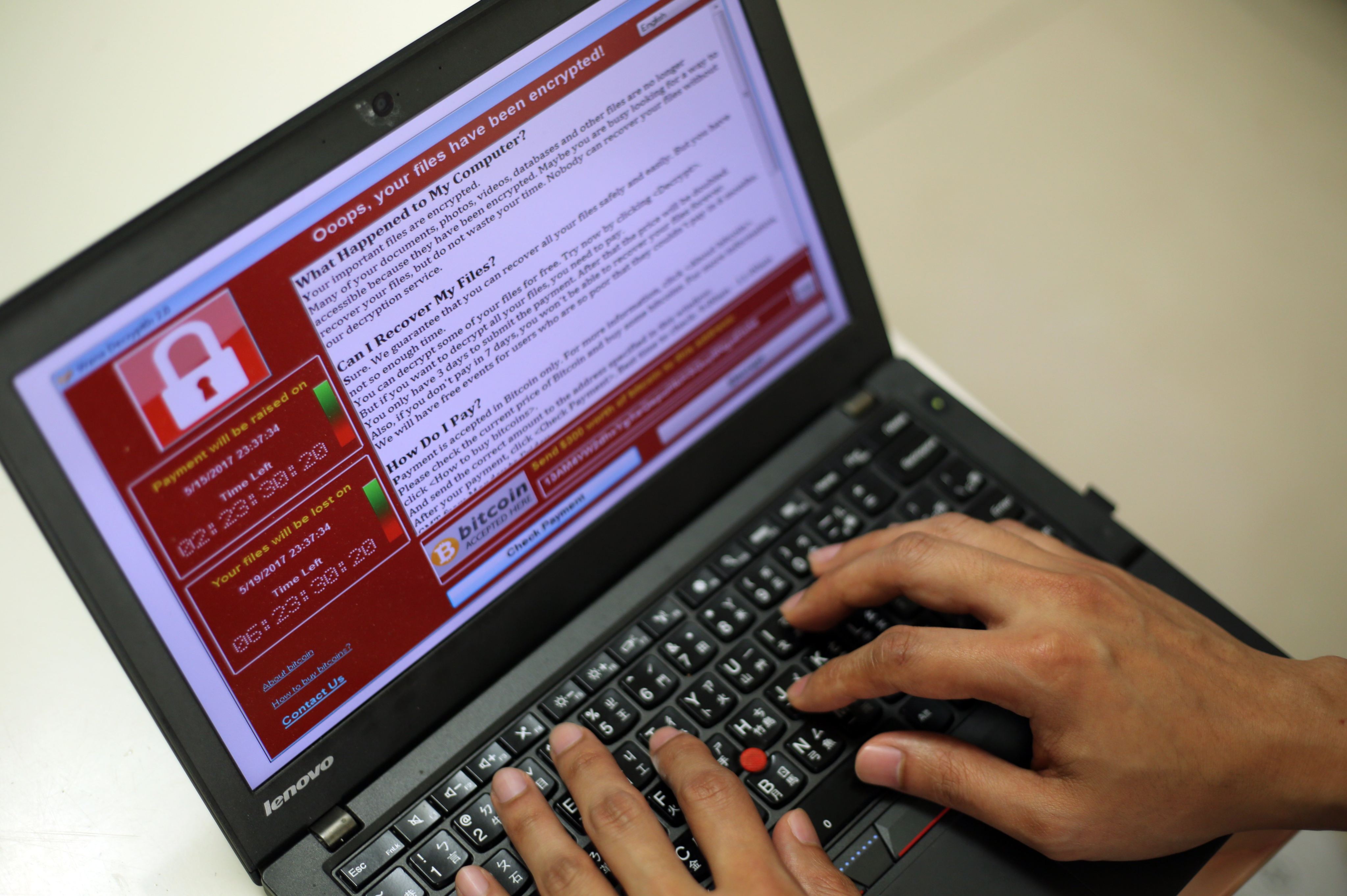 A programmer shows a sample of a ransomware cyberattack on a laptop in Taipei, Taiwan, May 13, 2017. Photo: EPA