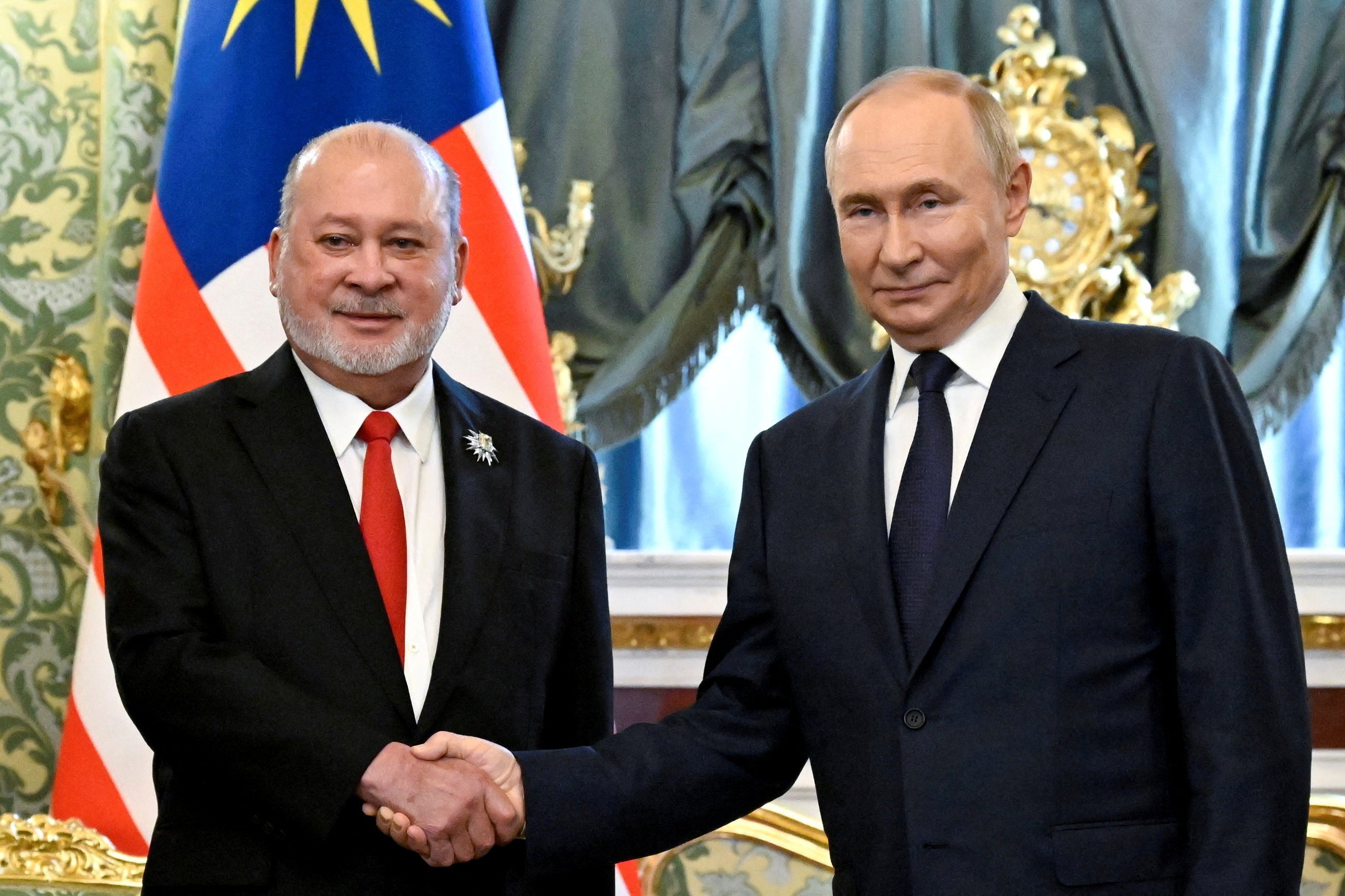 Russian President Vladimir Putin meets Malaysia’s King Sultan Ibrahim at the Kremlin in Moscow on Wednesday. Photo: Reuters