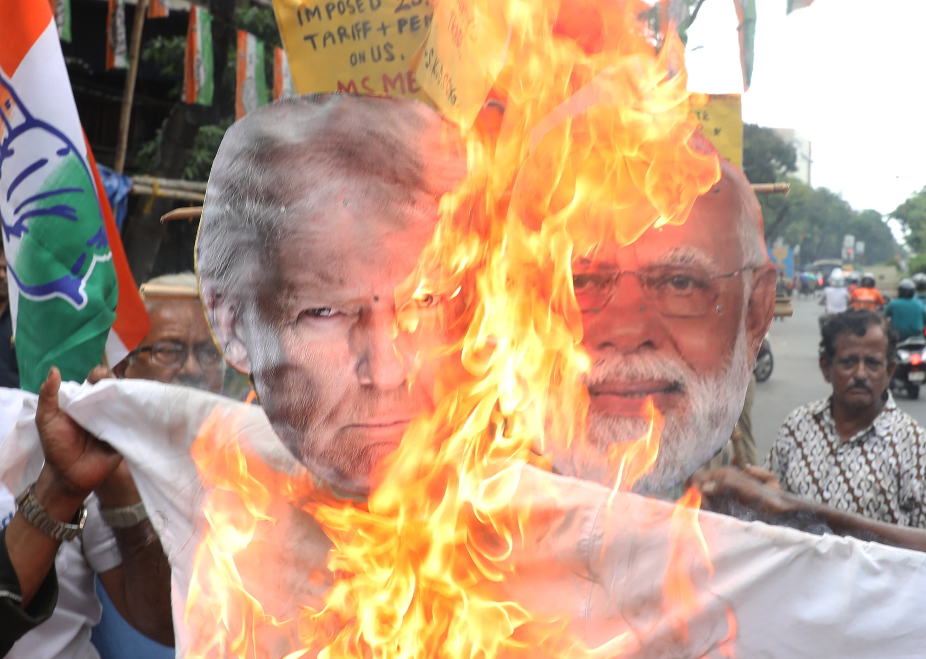 Supporters of India’s main opposition Congress party burn an effigy of US President Donald Trump and Indian Prime Minister Narendra Modi during a protest against the Trump administration’s 25 per cent tariff on all Indian goods. Photo: Zuma Press Wire/dpa
