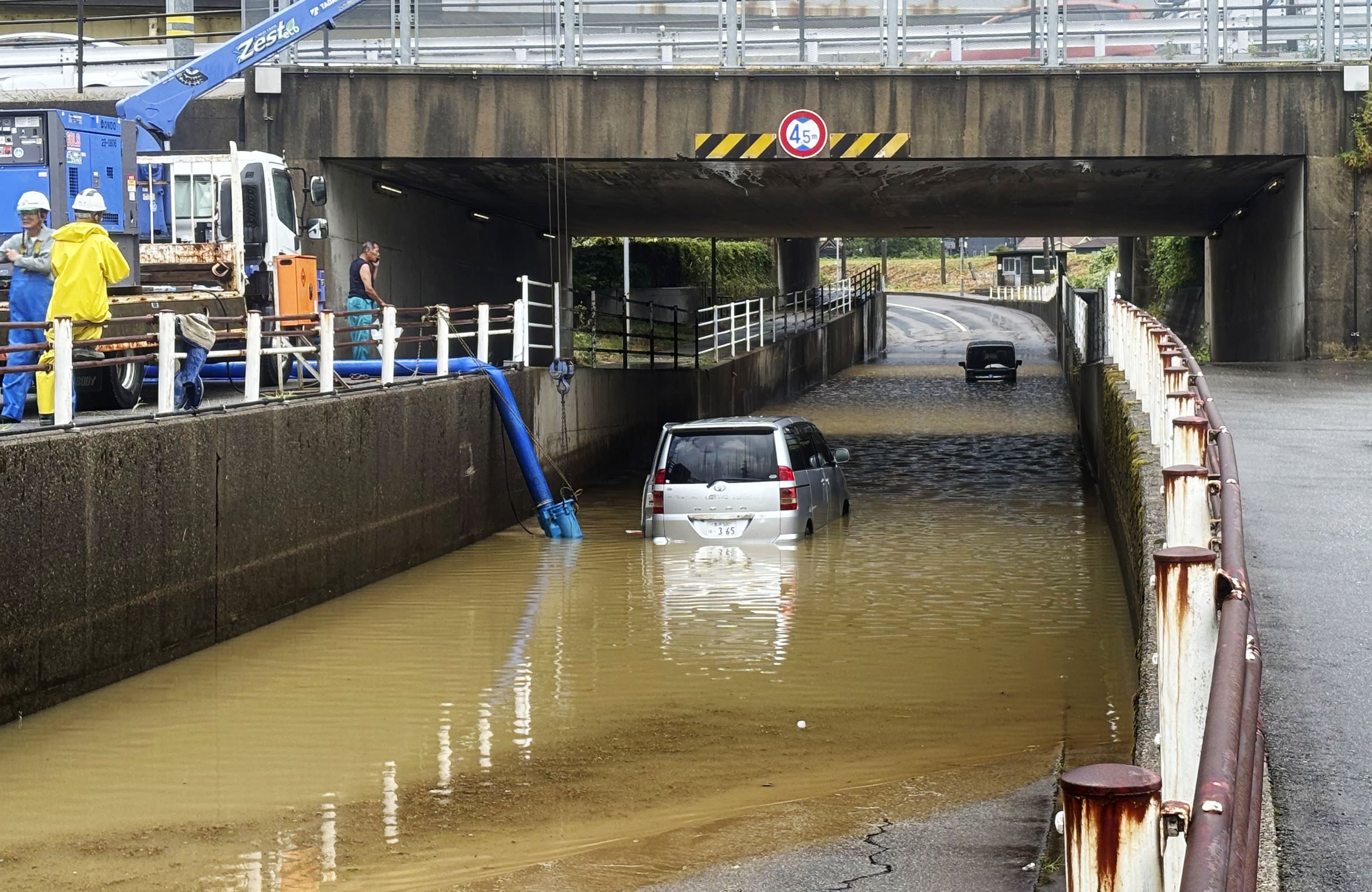 Cars trapped by floods are seen in Kanazawa, central Japan’s Ishikawa prefecture, following the record rainfall. Photo: Kyodo