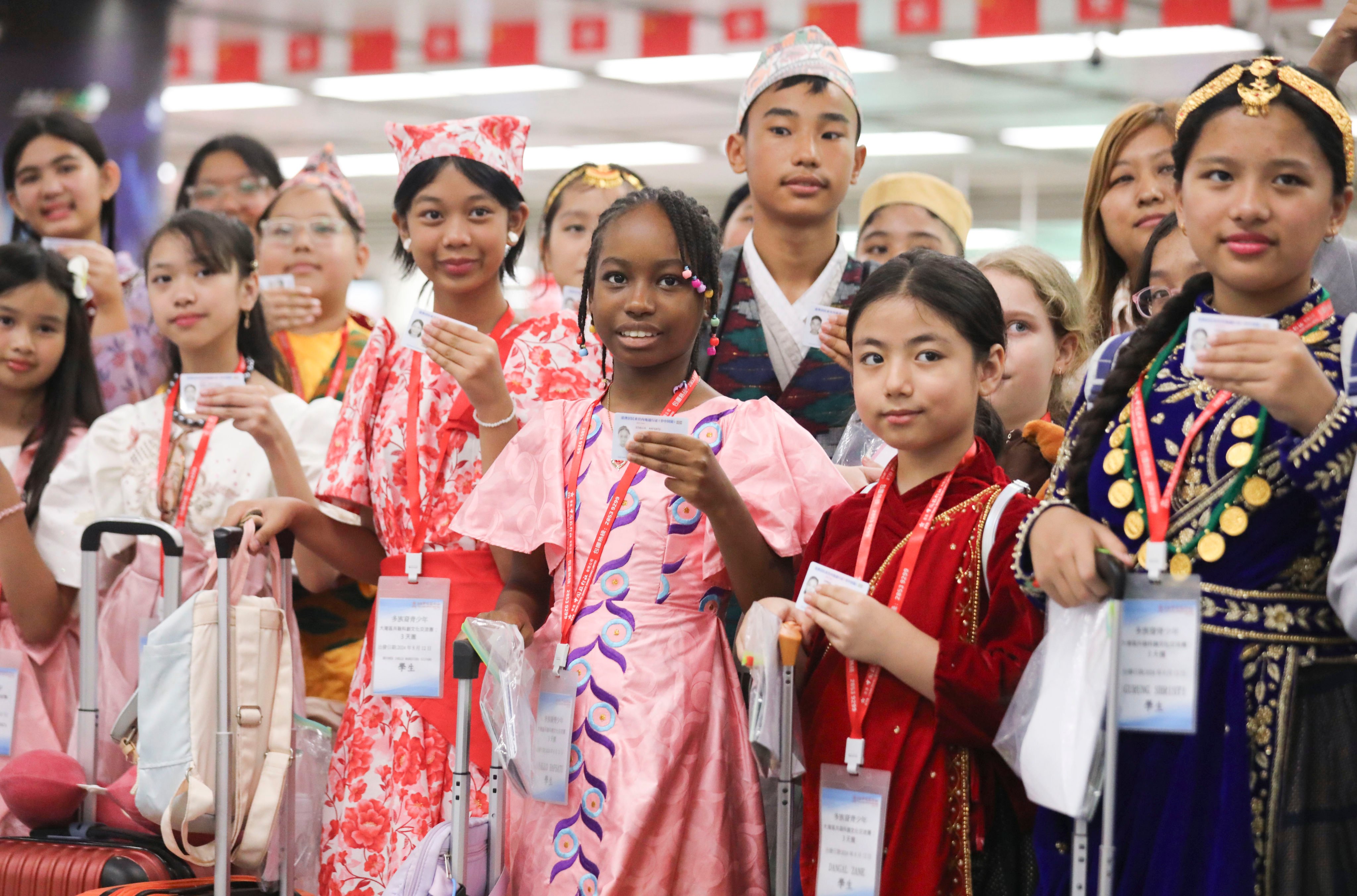 Young residents from diverse backgrounds holding new mainland travel permits return to Hong Kong in 2024, after a trip to Guangzhou and Foshan. Photo: Xiaomei Chen