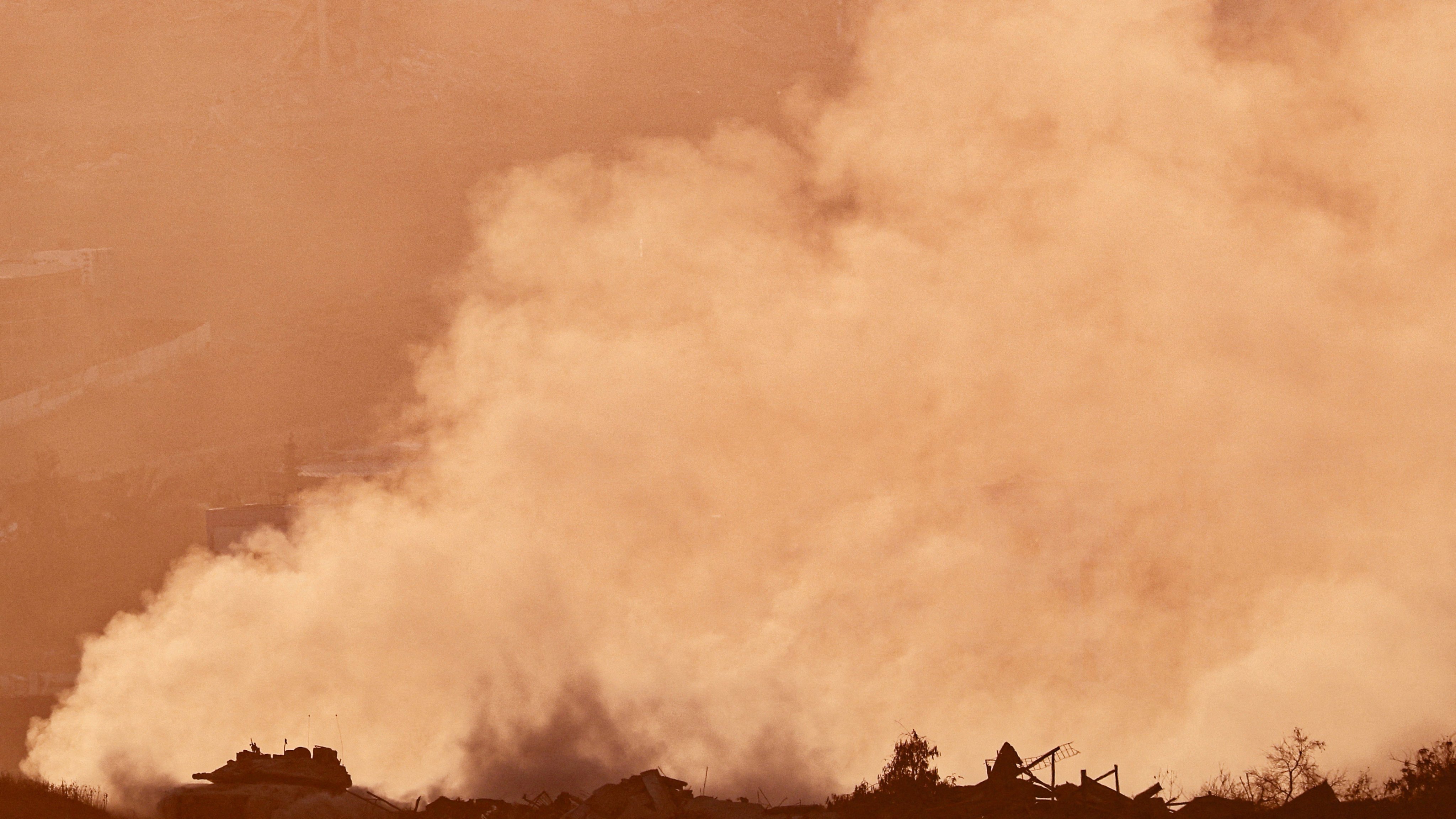 An Israeli tank carries out manoeuvres in Gaza as seen from the Israeli side of the border on July 28. Photo: Reuters