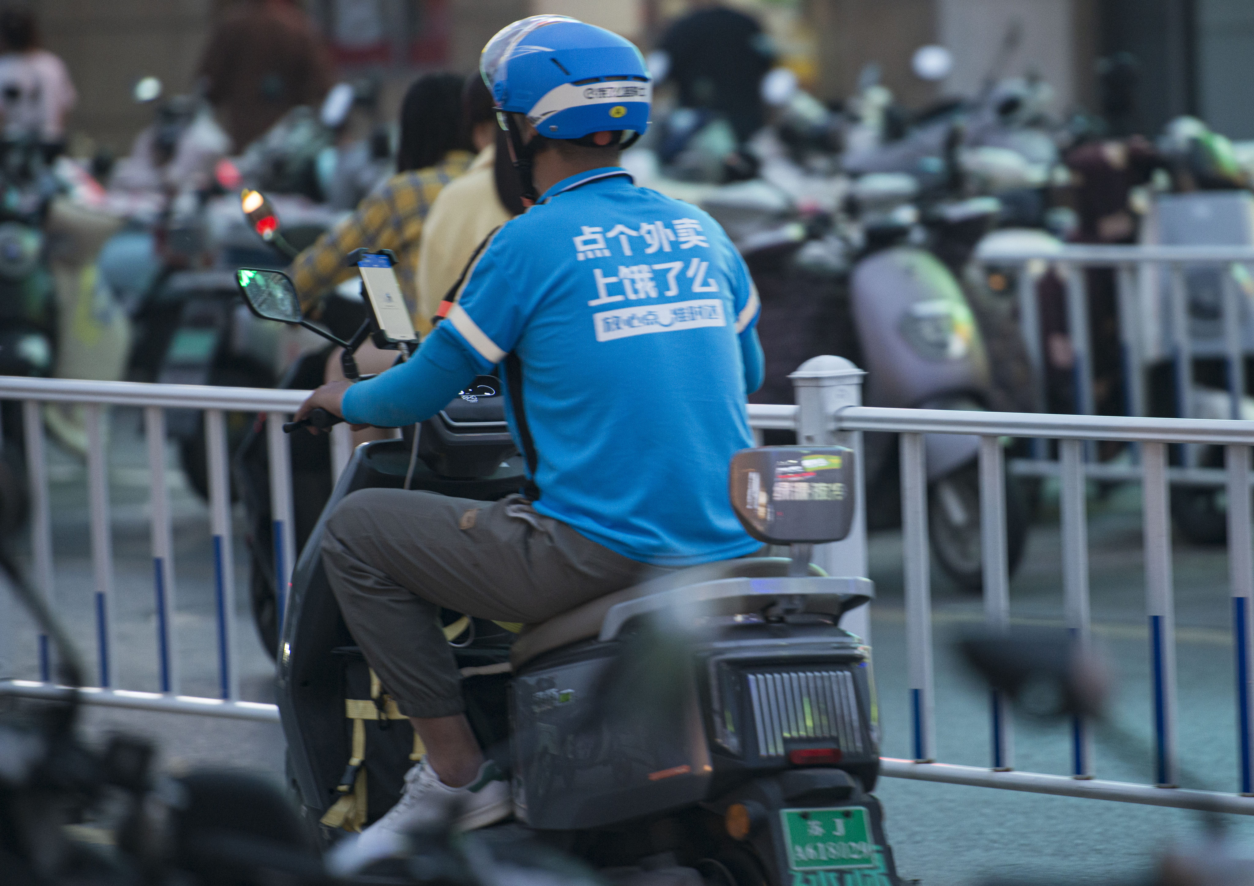A delivery rider for Alibaba’s Ele.me seen on the street in Yancheng, Jiangsu province, May 14, 2025. Photo: VCG via Getty Images