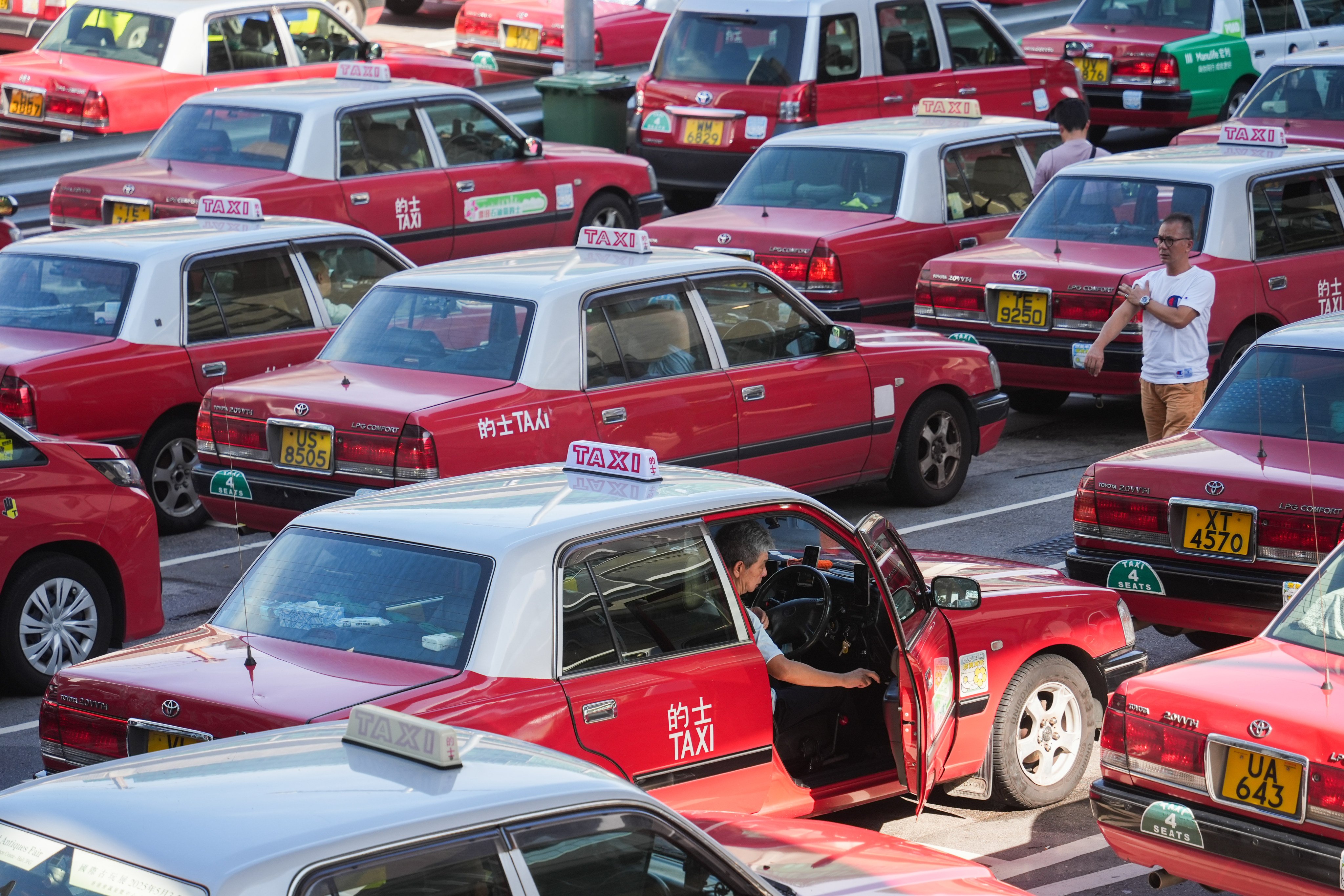 Taxis are lined up at the Hong Kong International Airport in Chek Lap Kok on August 9. To suggest that requiring older taxi drivers to have annual fitness checks is a kind of ageism is outrageous. Photo: Eugene Lee