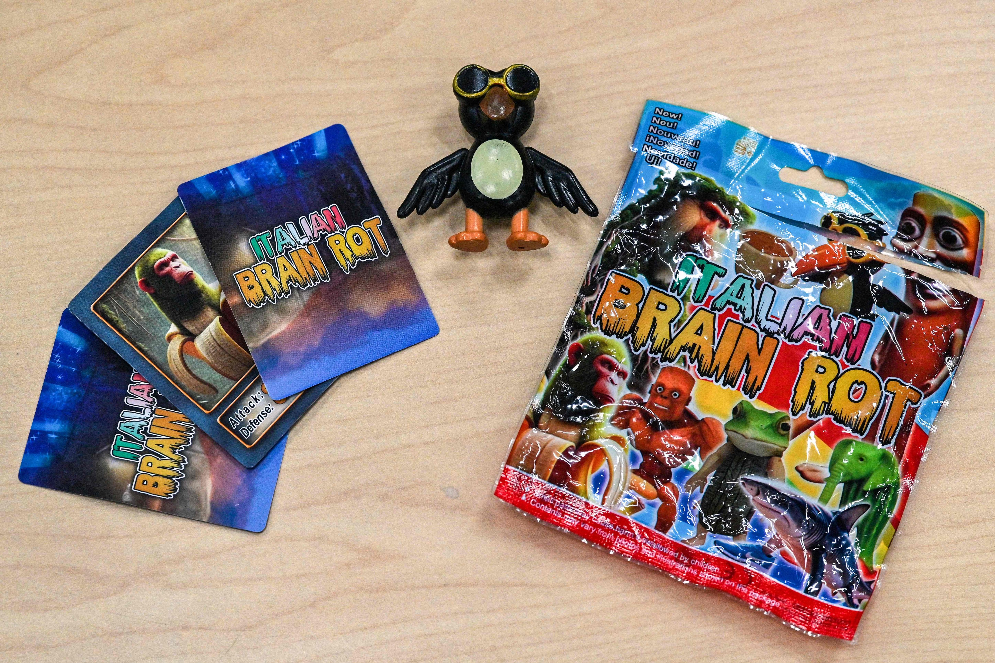 This small bag of novelty merchandise for the online phenomenon called Italian Brainrot, containing collectable cards and a small figure of Frulli Frulla (centre), was purchased from a shop in Tokyo. Photo: AFP