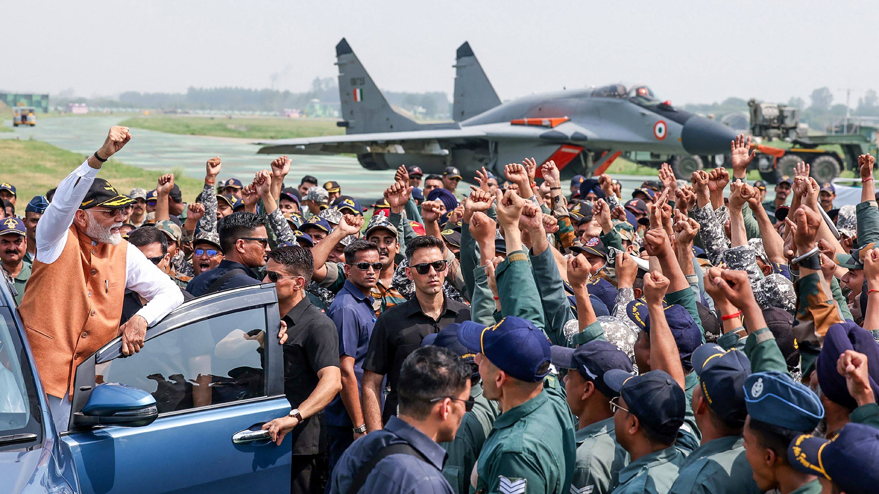 India’s Prime Minister Narendra Modi (left) during a visit to Adampur Airforce Base in Punjab. Photo: Indian Press Information Bureau / AFP