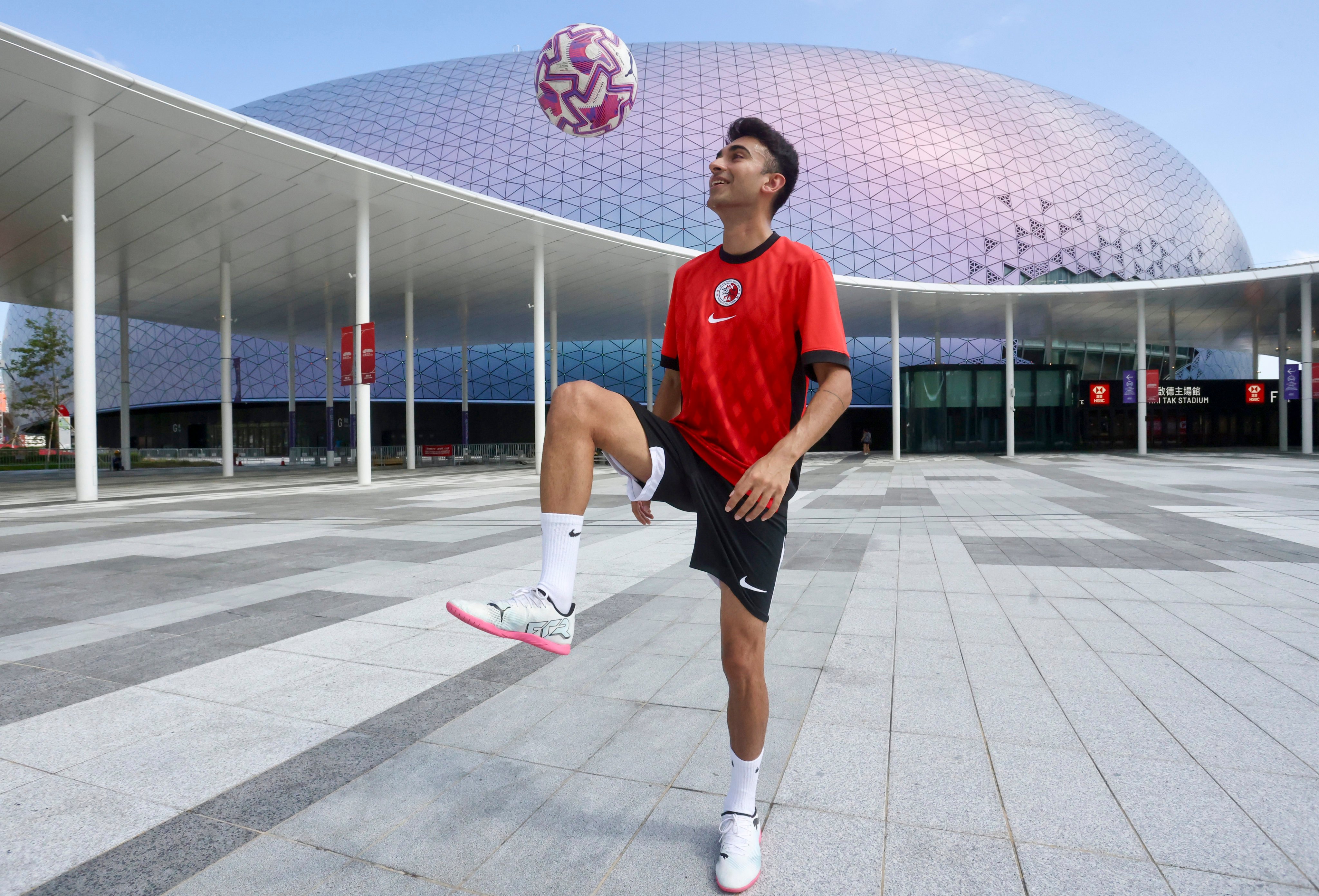 Hong Kong football influencer Jeh Vas shows off his skills in front of Kai Tak Stadium. Photo: Jonathan Wong