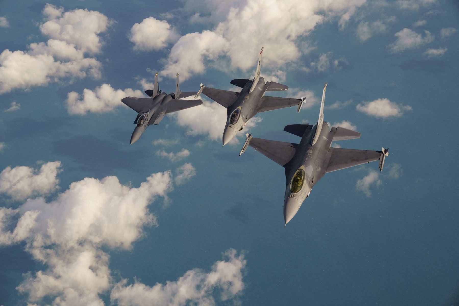 An RSAF F-15 air-superiority fighter (centre) and two F-16s fly in formation over the South China Sea in 2018. Photo: AFP