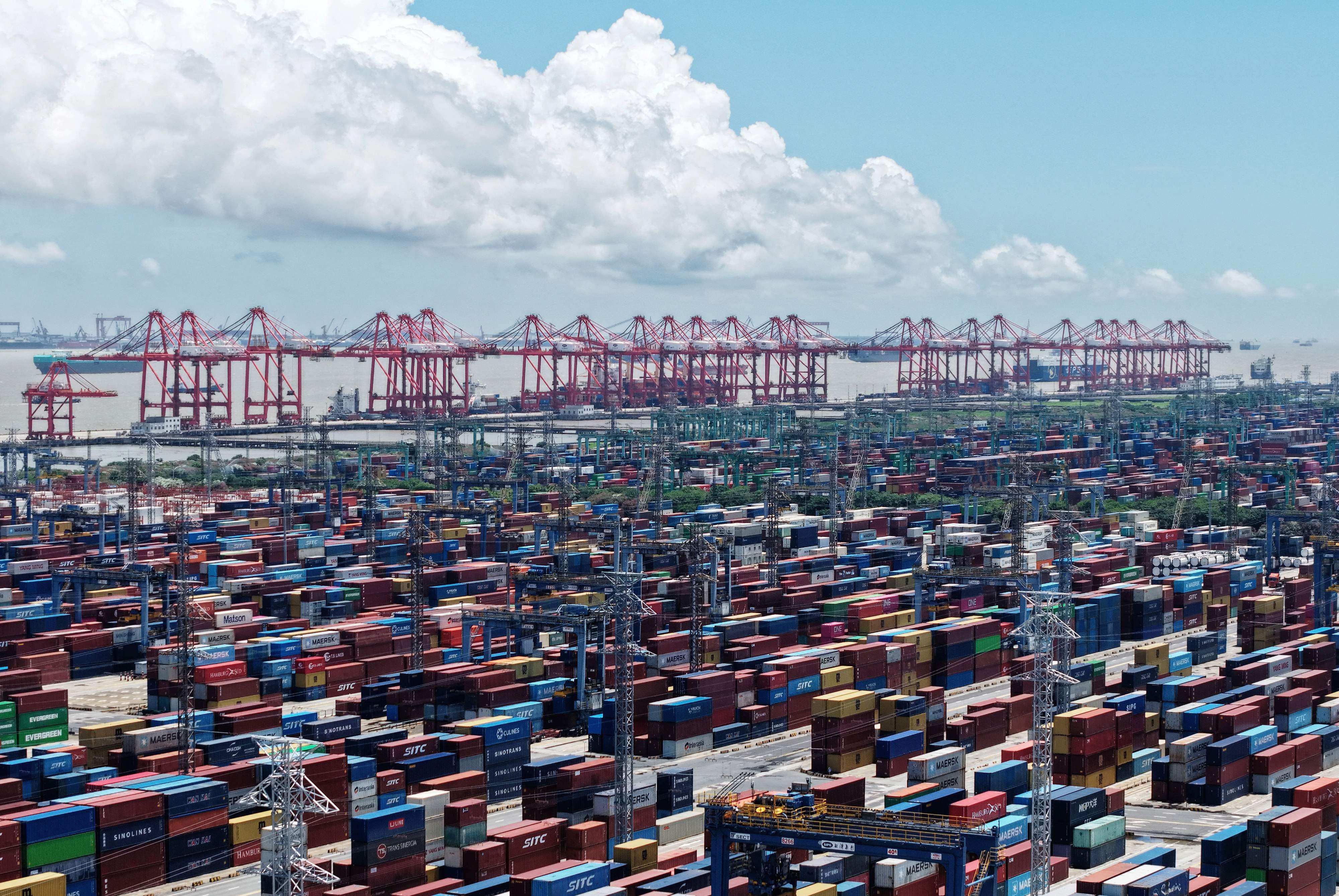 Containers are seen at a port in Shanghai on Thursday. The latest shipping rates from Shanghai to the US west coast and east coast have fallen by more than half from their peak in early June. Photo: AFP