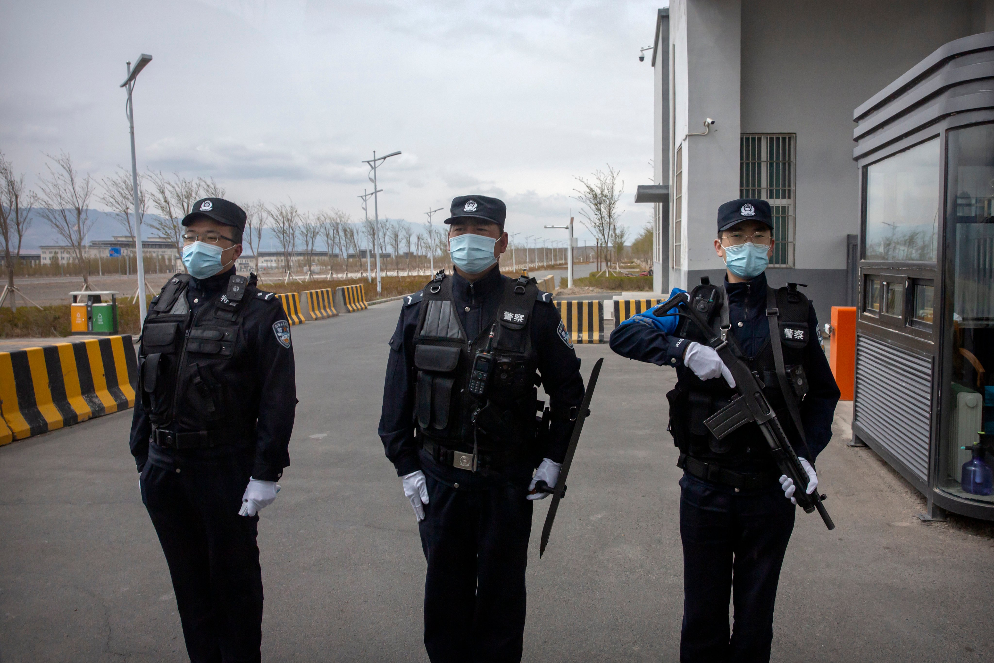 Officers at the entrance of a detention centre in China’s Xinjiang Uygur autonomous region on April 23, 2021. The US State Department’s annual review of China’s human rights record continued to cite Beijing’s treatment of Uygurs and other Muslim minorities there. Photo: AP