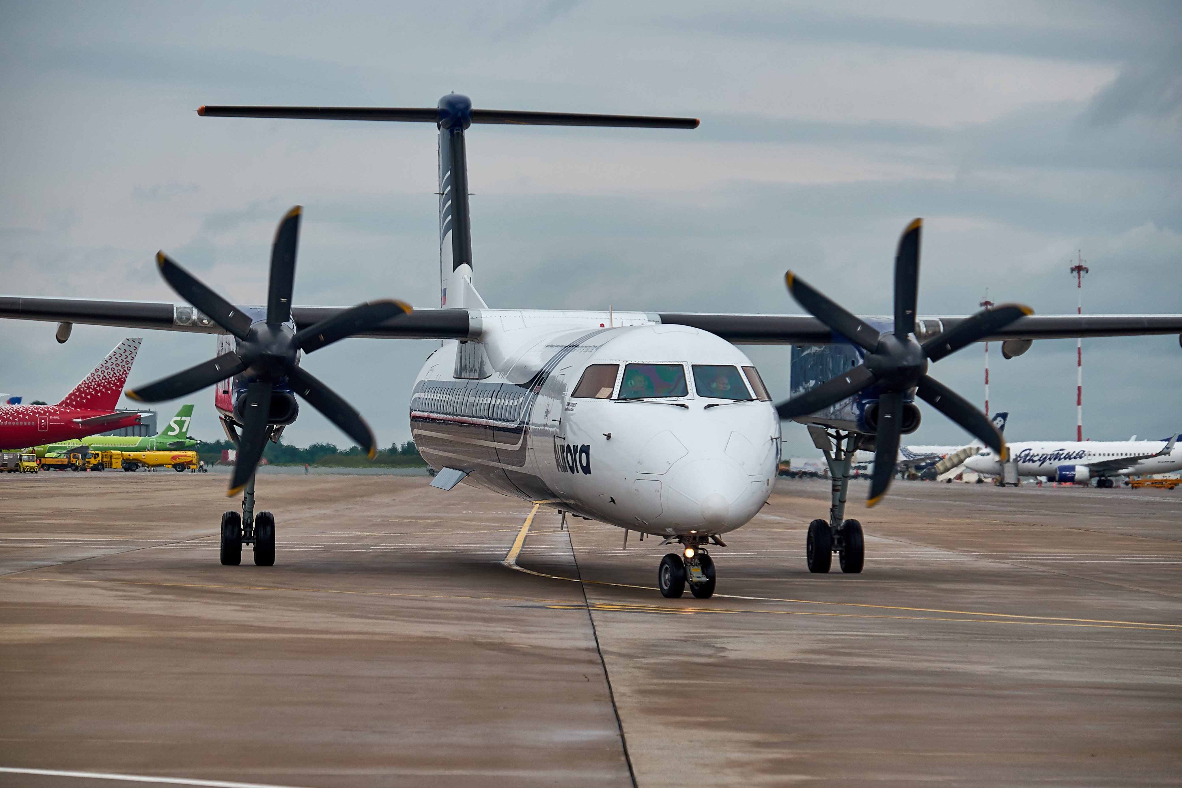 Passenger plane Bombardier Q400 of Aurora Airlines on runway in Russia’s Vladivostok. Photo: Shutterstock Images