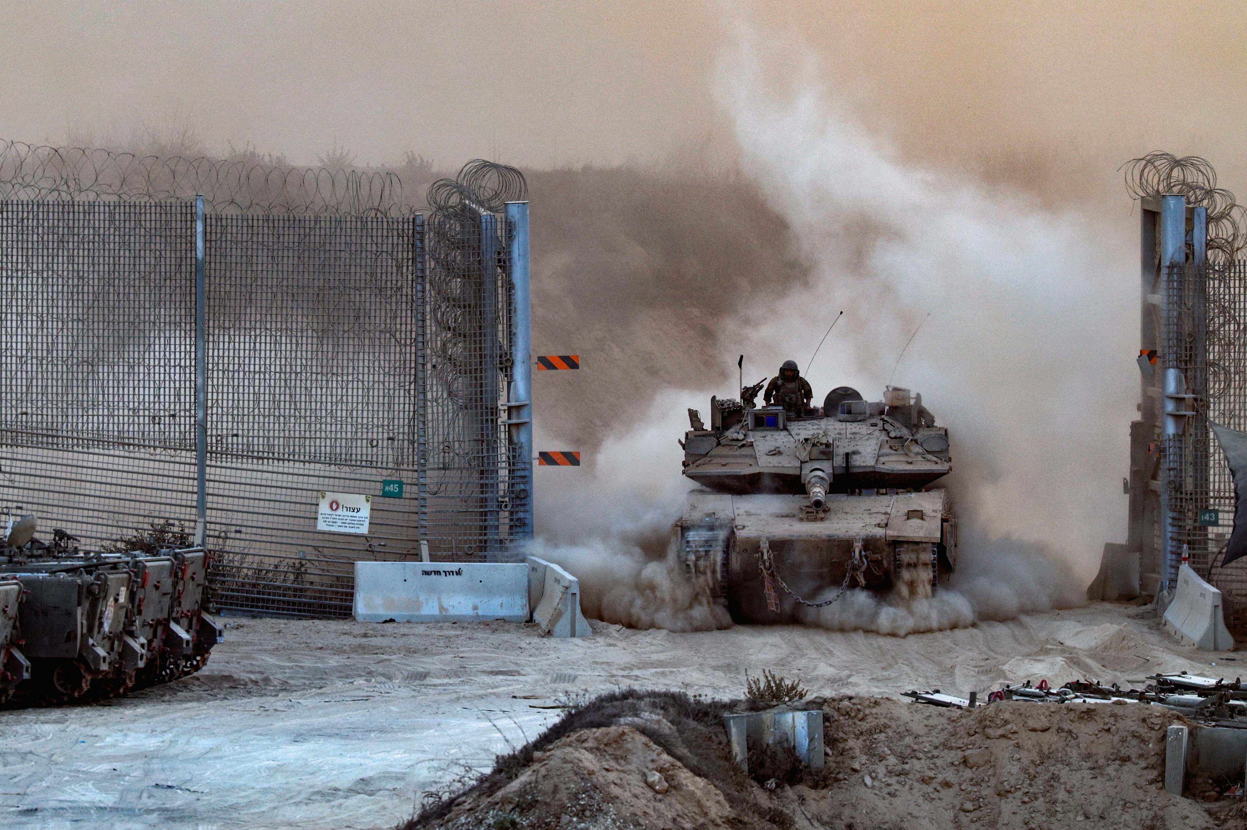 An Israeli tank enters Israel from Gaza last month. Photo: Reuters