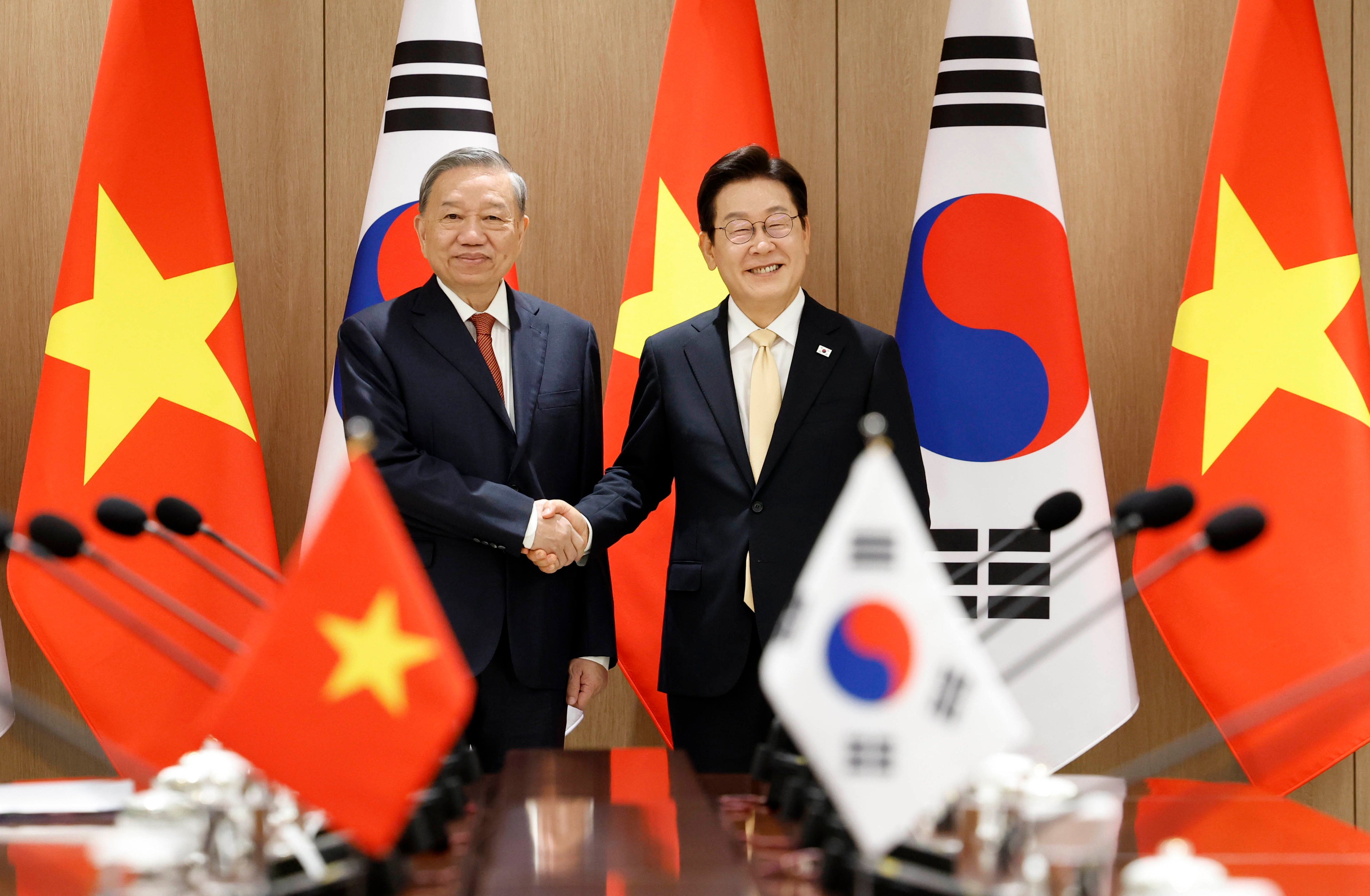 South Korean President Lee Jae-myung (right) shakes hands with To Lam, general secretary of Vietnam’s Communist Party, in Seoul on Monday. Photo: Yonhap/dpa