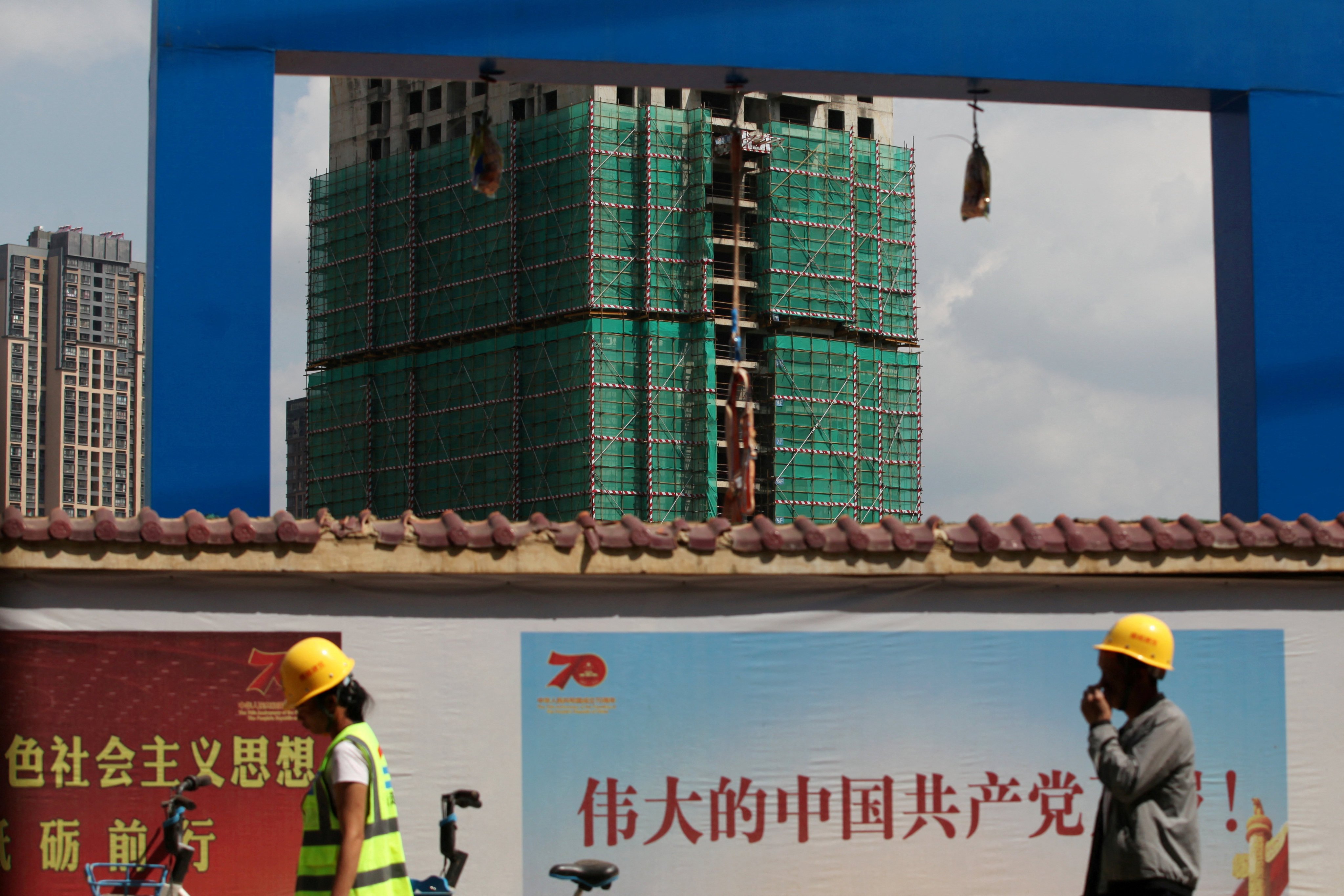 Four years after China’s premier real estate developer fell into a debt crisis, the country’s homeowners are still unsure when housing prices will hit bottom. Photo: Reuters