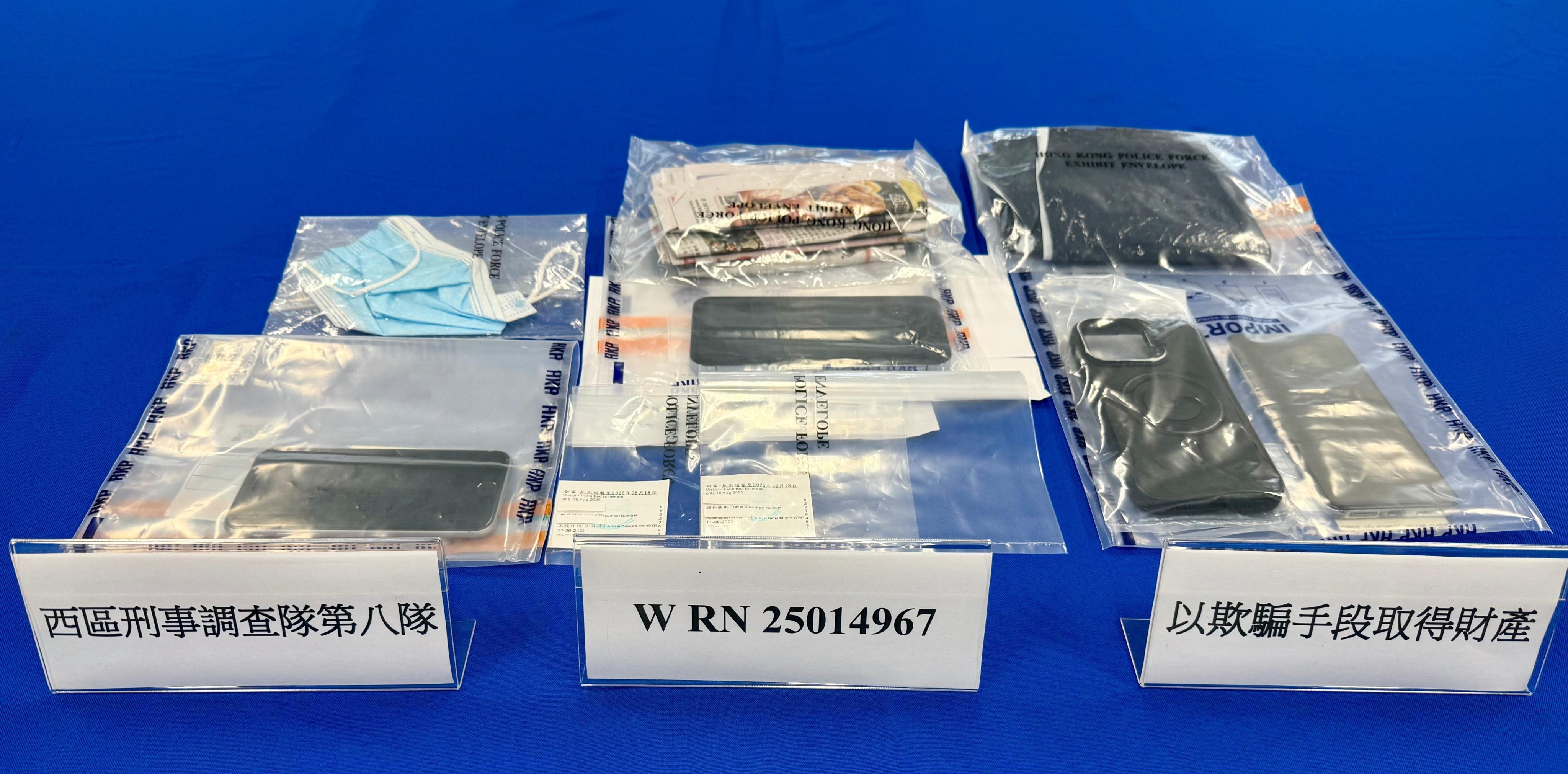 Hong Kong police have arrested two mainland Chinese men for allegedly trying to cheat an elderly woman out of HK$100,000 in a phone scam. Photo: Handout
