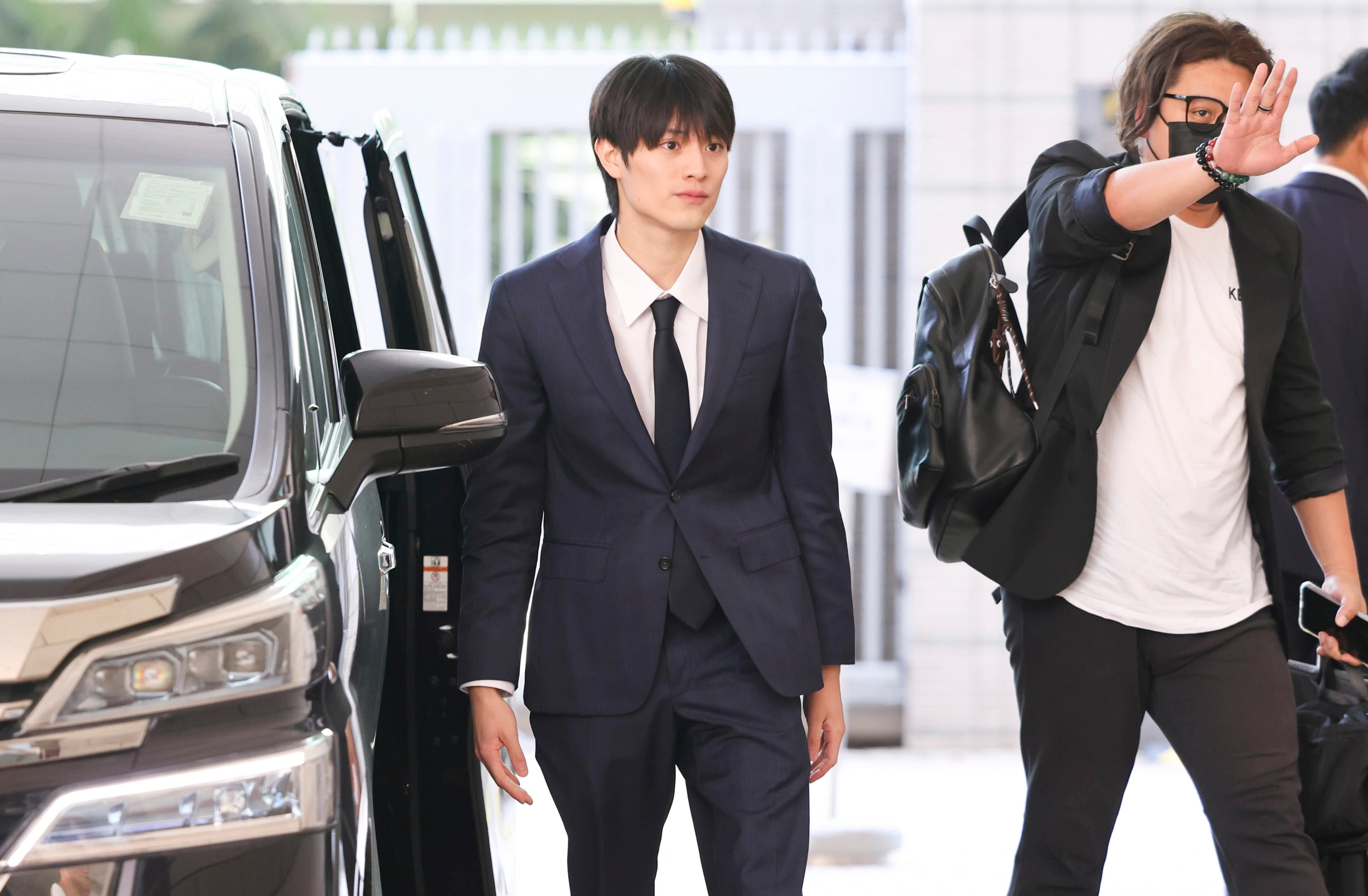 Japanese pop idol Kenshin Kamimura (left) entering court. Photo: Karma Lo